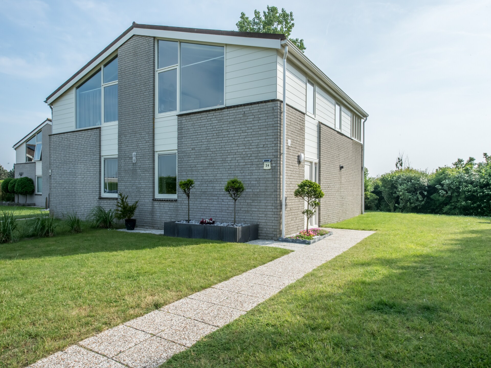 Ostrea 34: Luxe vakantiehuis met weids uitzicht aan bos en golfbaan - foto 5