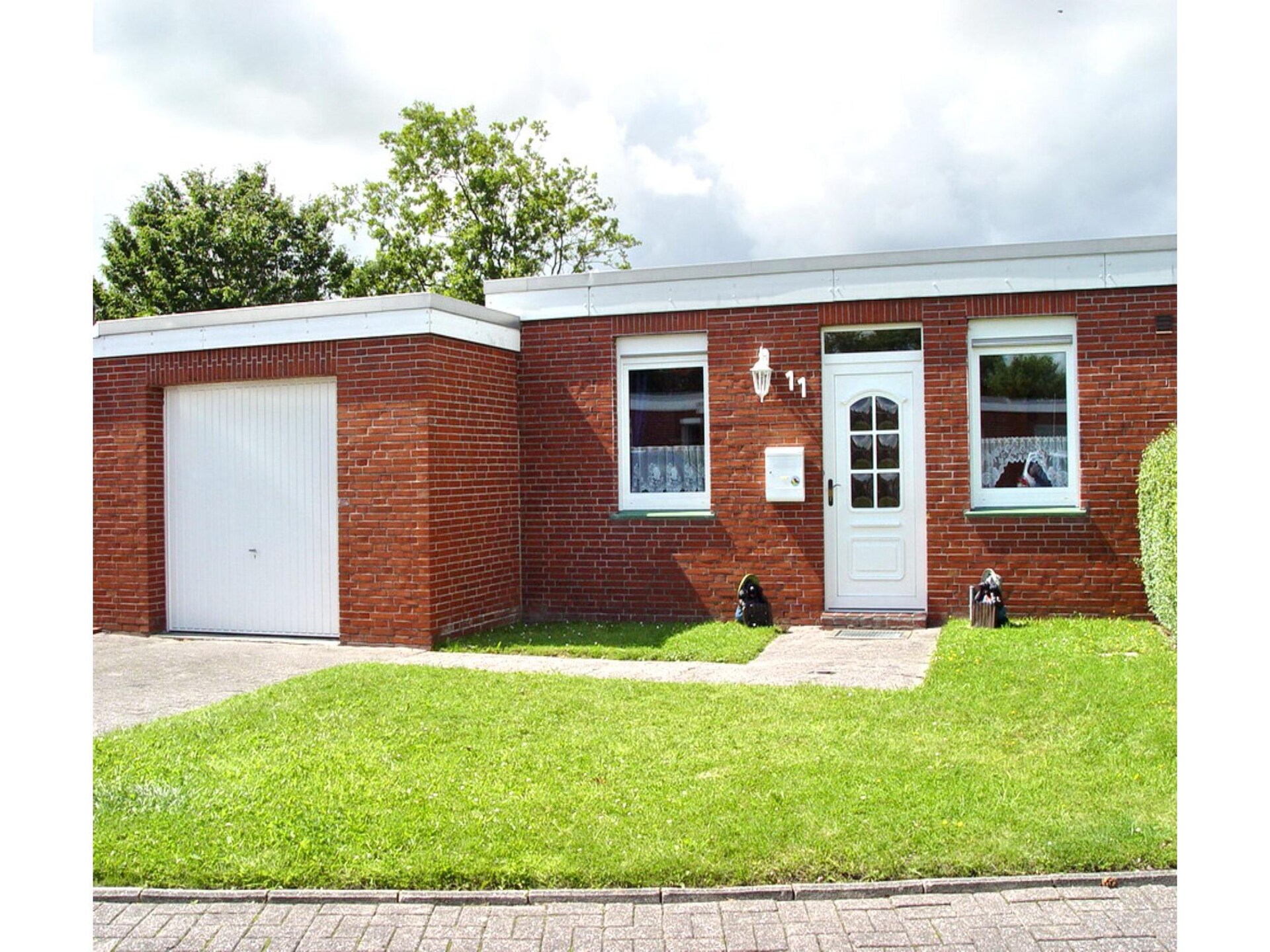 Knusse bungalow bij zee met fietsen, tuin en tennisbaan in Dornumersiel - foto 1