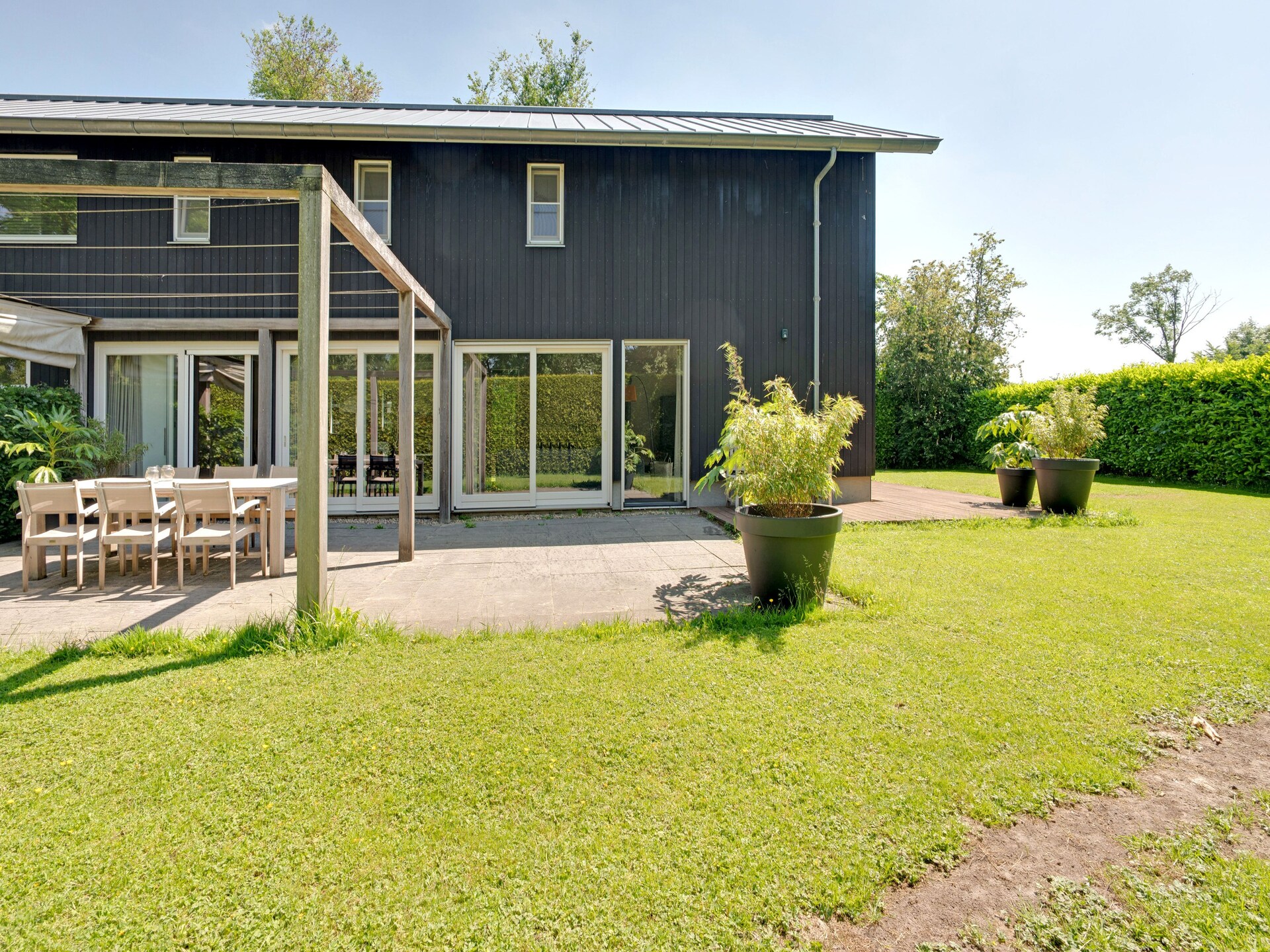 Stijlvol familiehuis aan het water in Grou met tuin, trampoline en golfbaan - foto 27