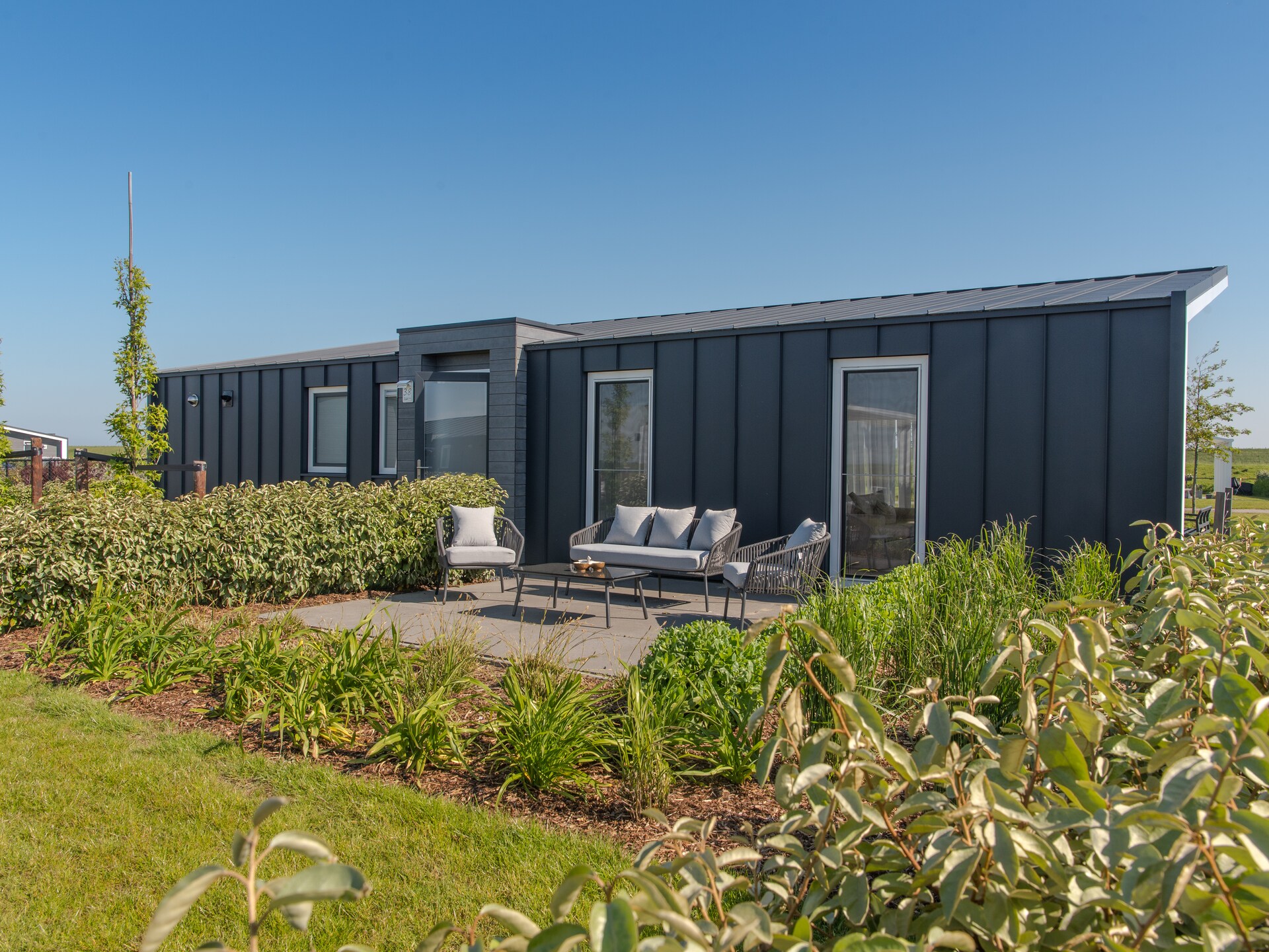 Modern vakantiehuis met overdekt terras aan de Oosterschelde in Wemeldinge - foto 12