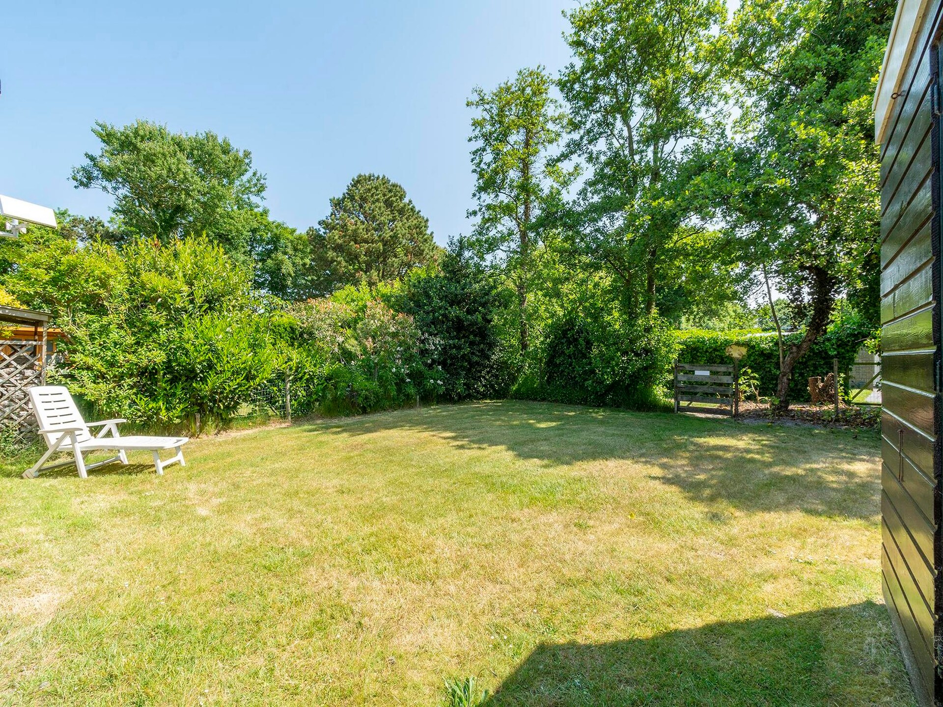 Vrijstaande bungalow met omheinde tuin, 4 km van strand Sint Maartenszee - foto 16