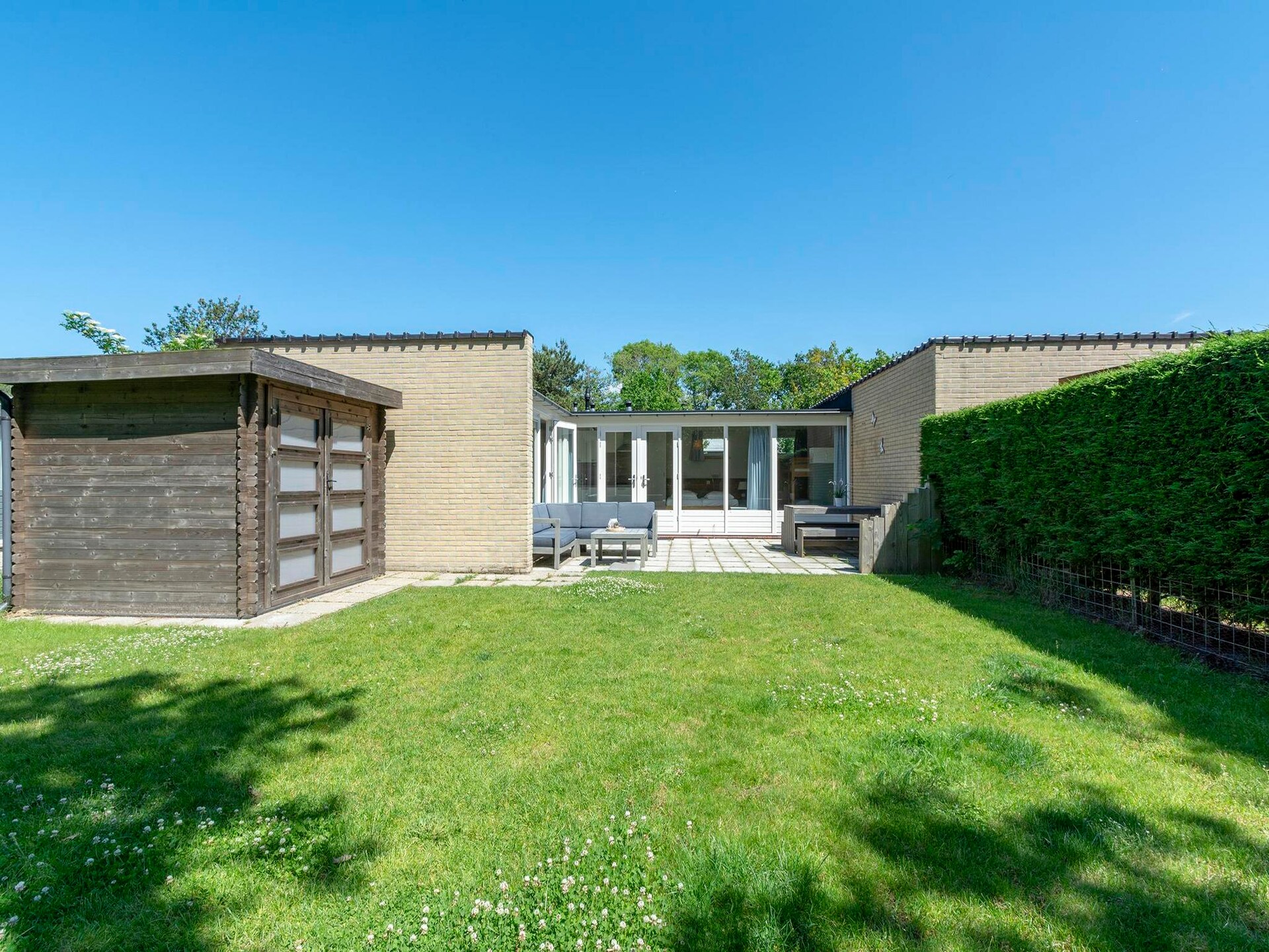 Vrijstaande kustbungalow met omheinde tuin in Sint Maartenszee - foto 18