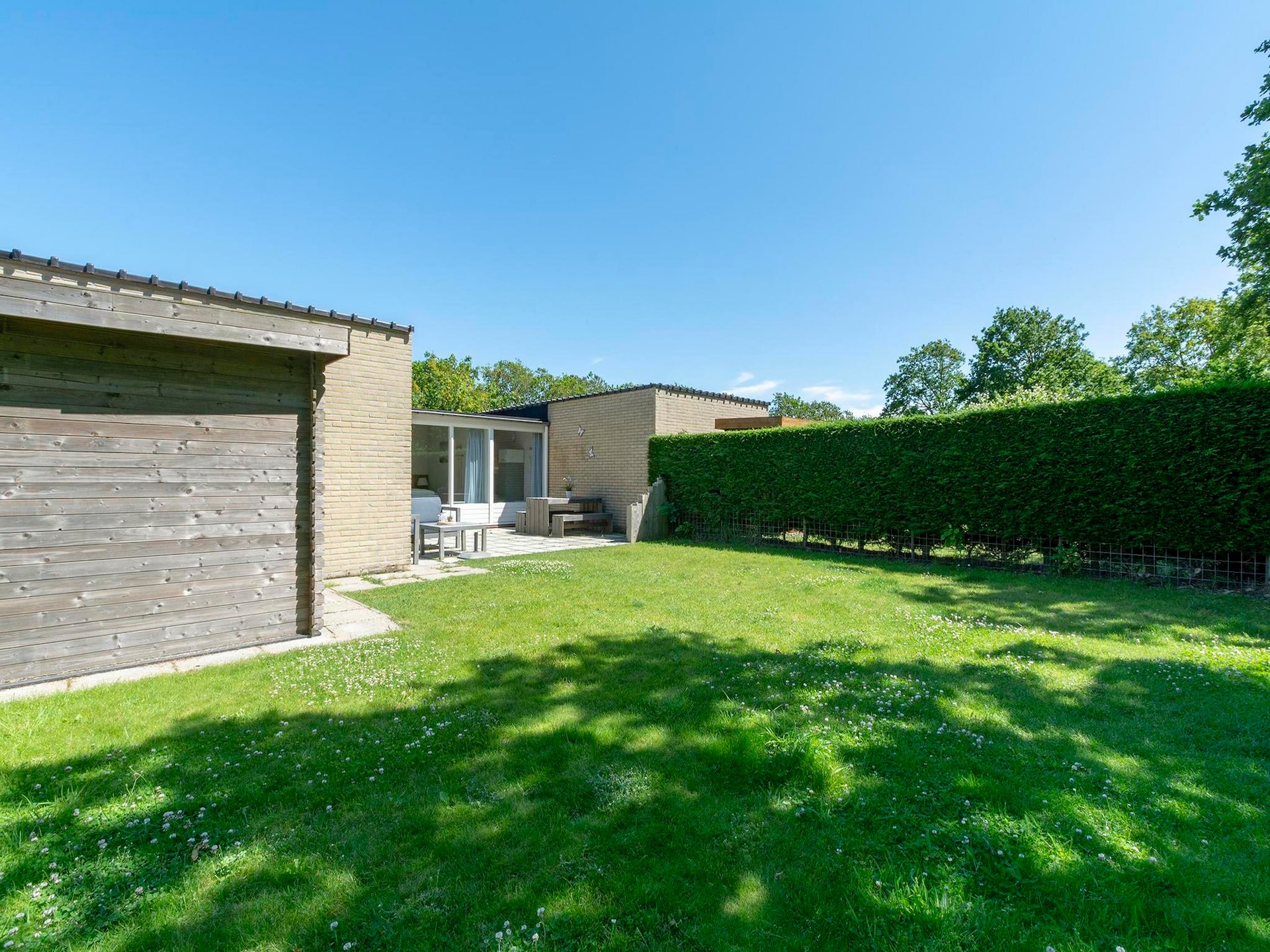 Vrijstaande kustbungalow met omheinde tuin in Sint Maartenszee - foto 19
