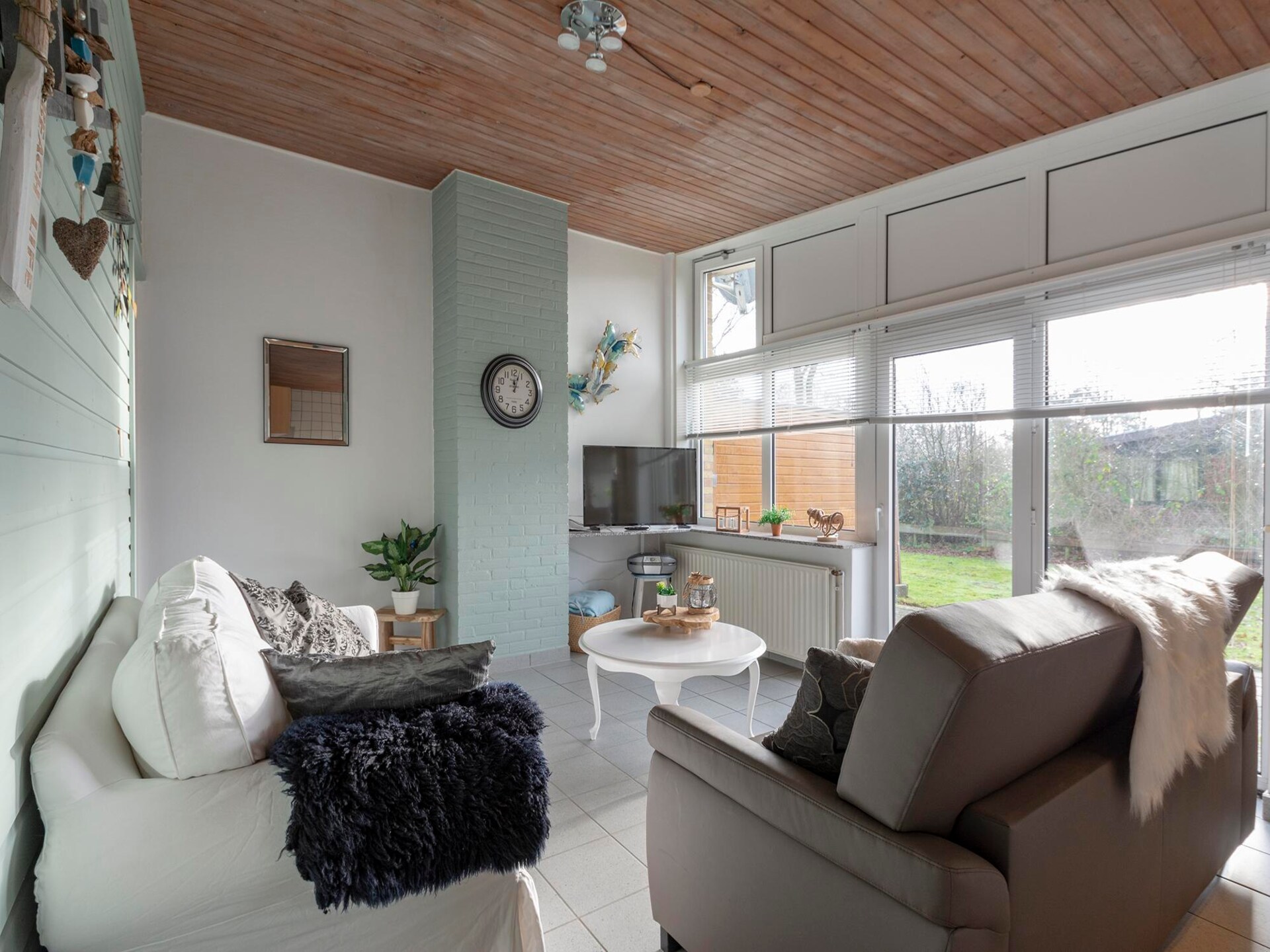 Knusse strandbungalow met omheinde tuin nabij Sint Maartenszee - foto 9