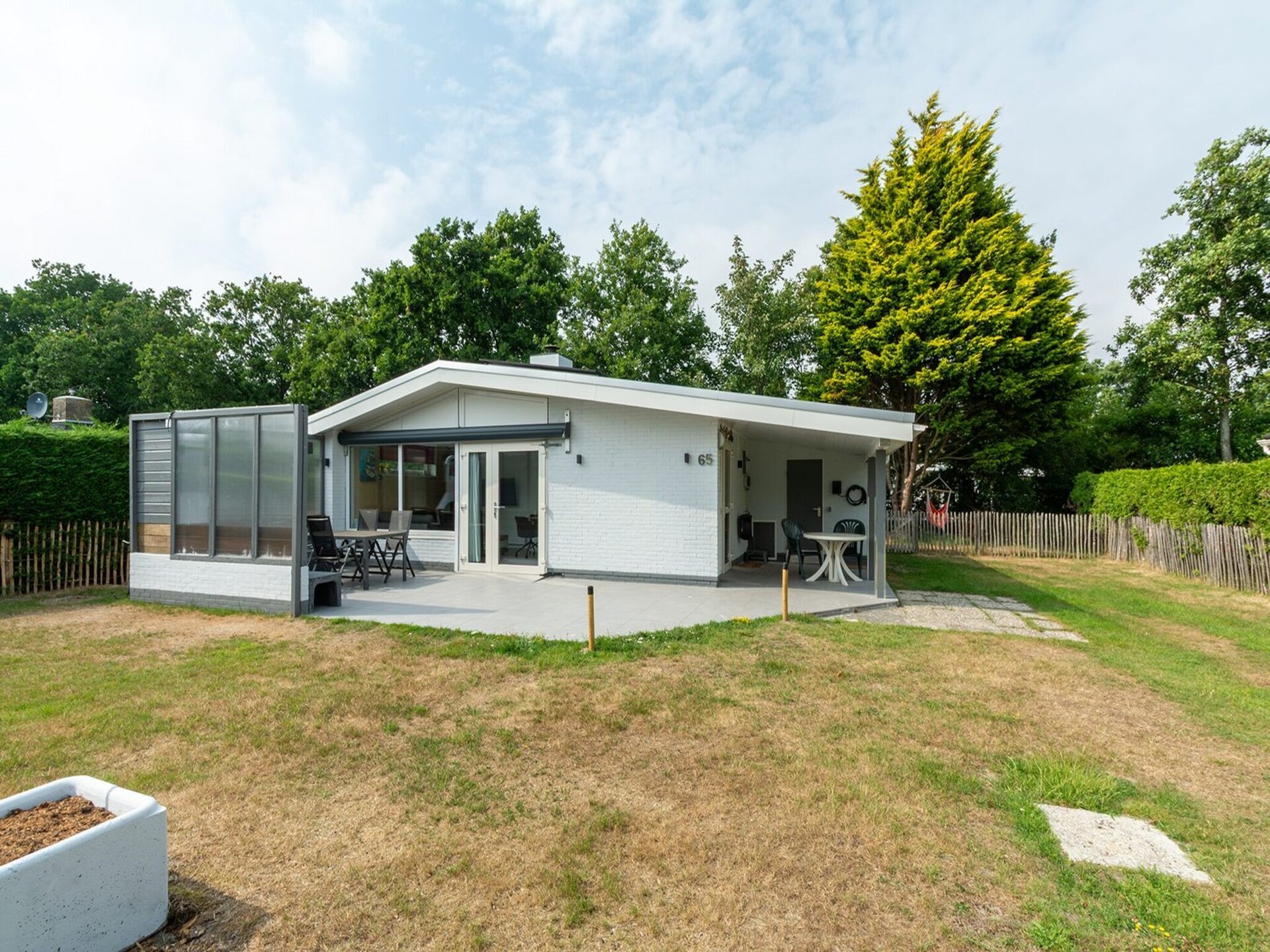 Vrijstaande bungalow met grote tuin op 1,6 km van strand Sint Maartenszee - foto 6