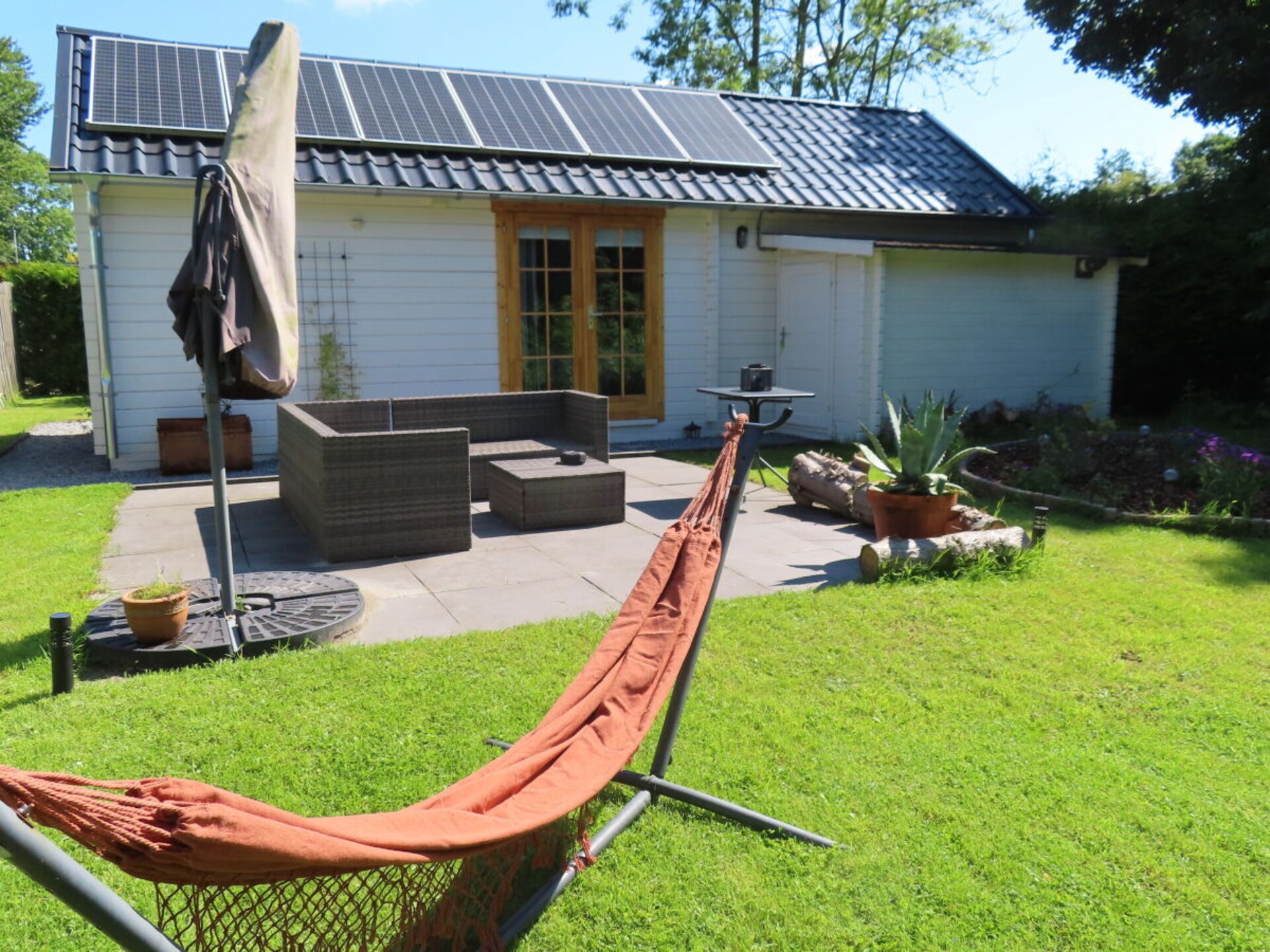 Tiny Botanic House: knus vakantiehuis met tuin en zwembad bij de Waddenzee - foto 3