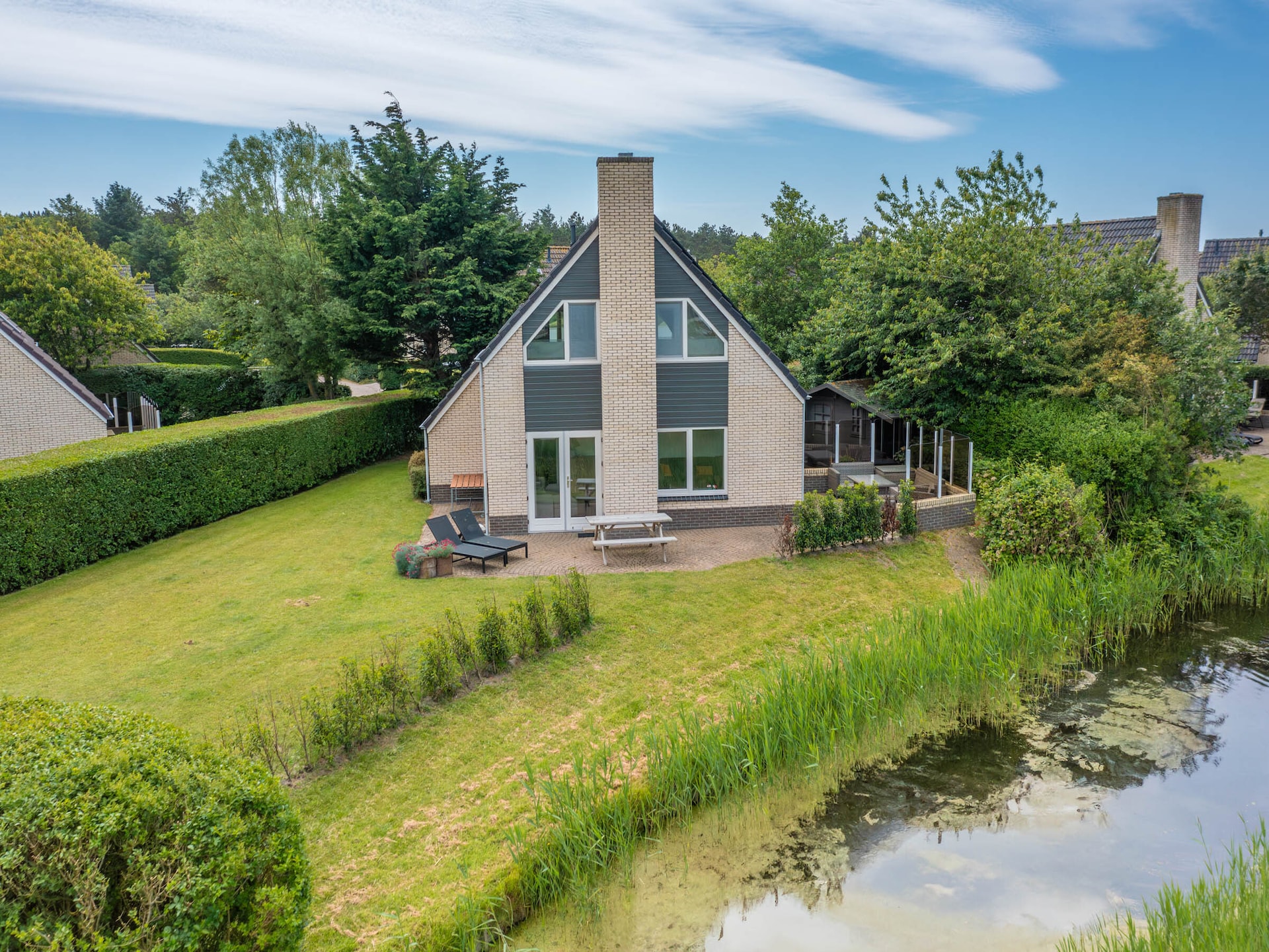 Luxe vrijstaande villa met whirlpool aan bosrand van De Koog - foto 2