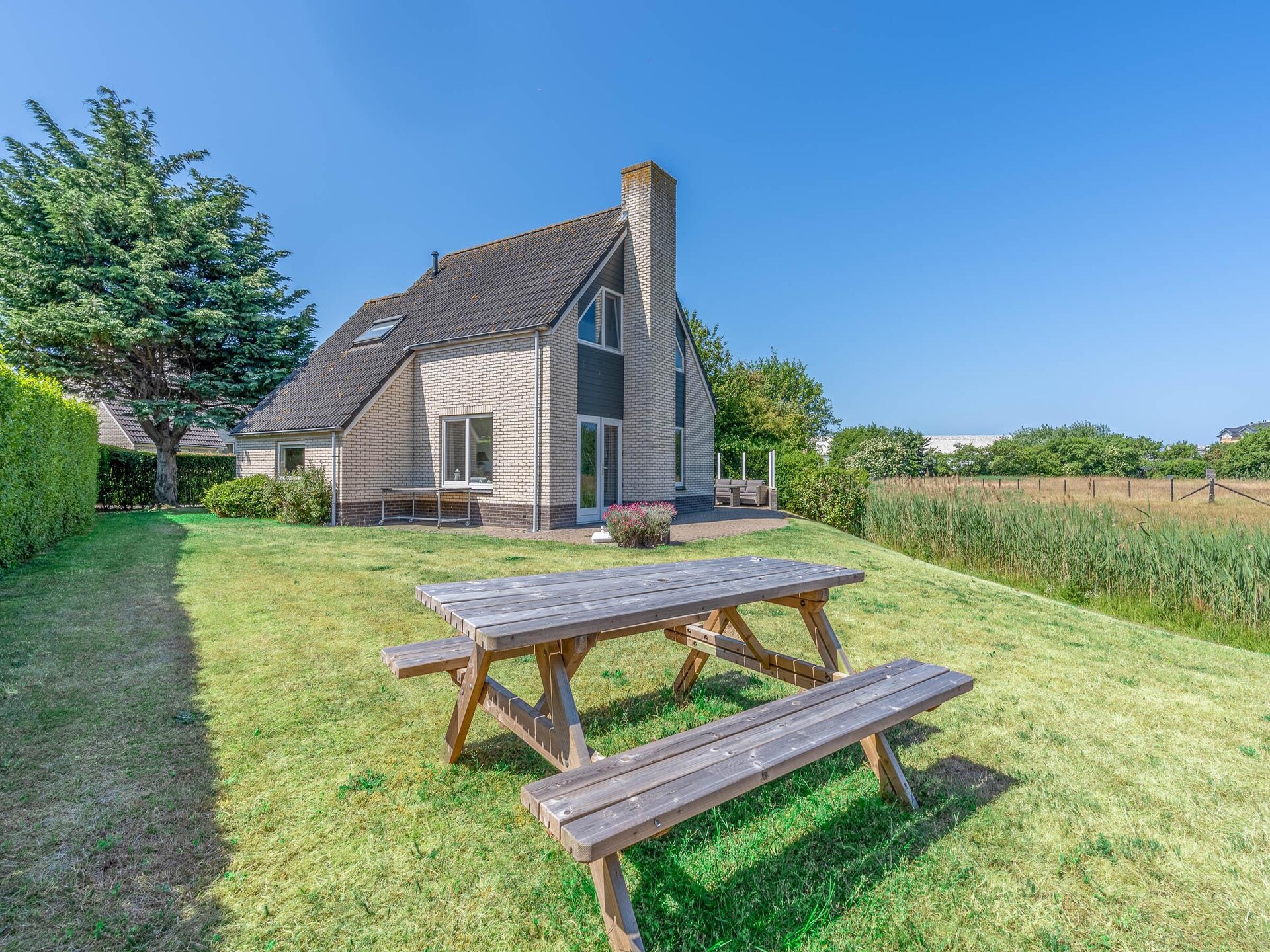 Luxe vrijstaande villa met whirlpool aan bosrand van De Koog - foto 3