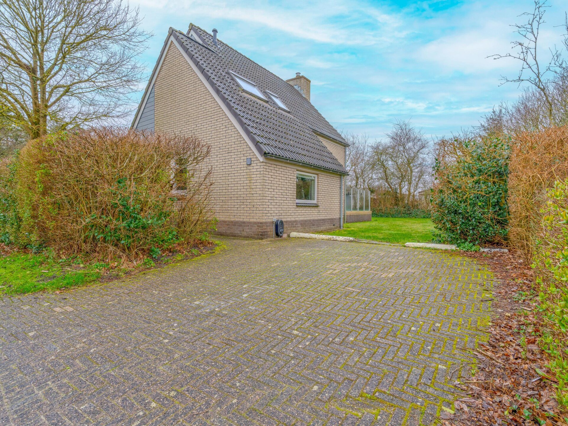 Vrijstaande villa met whirlpool op vakantiepark in bosrijke omgeving bij De Koog - foto 16