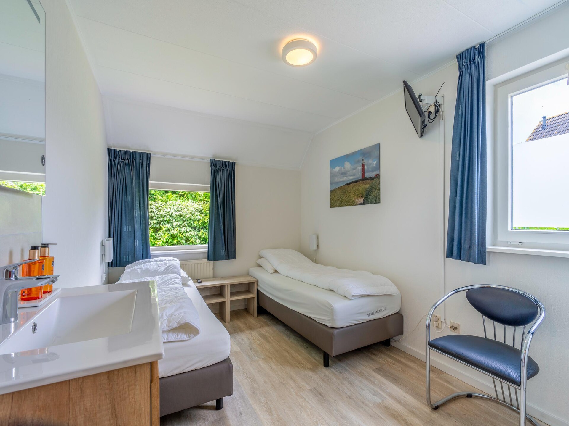 Luxe 6-persoons villa met sauna en whirlpool in bosrijk De Koog - foto 9