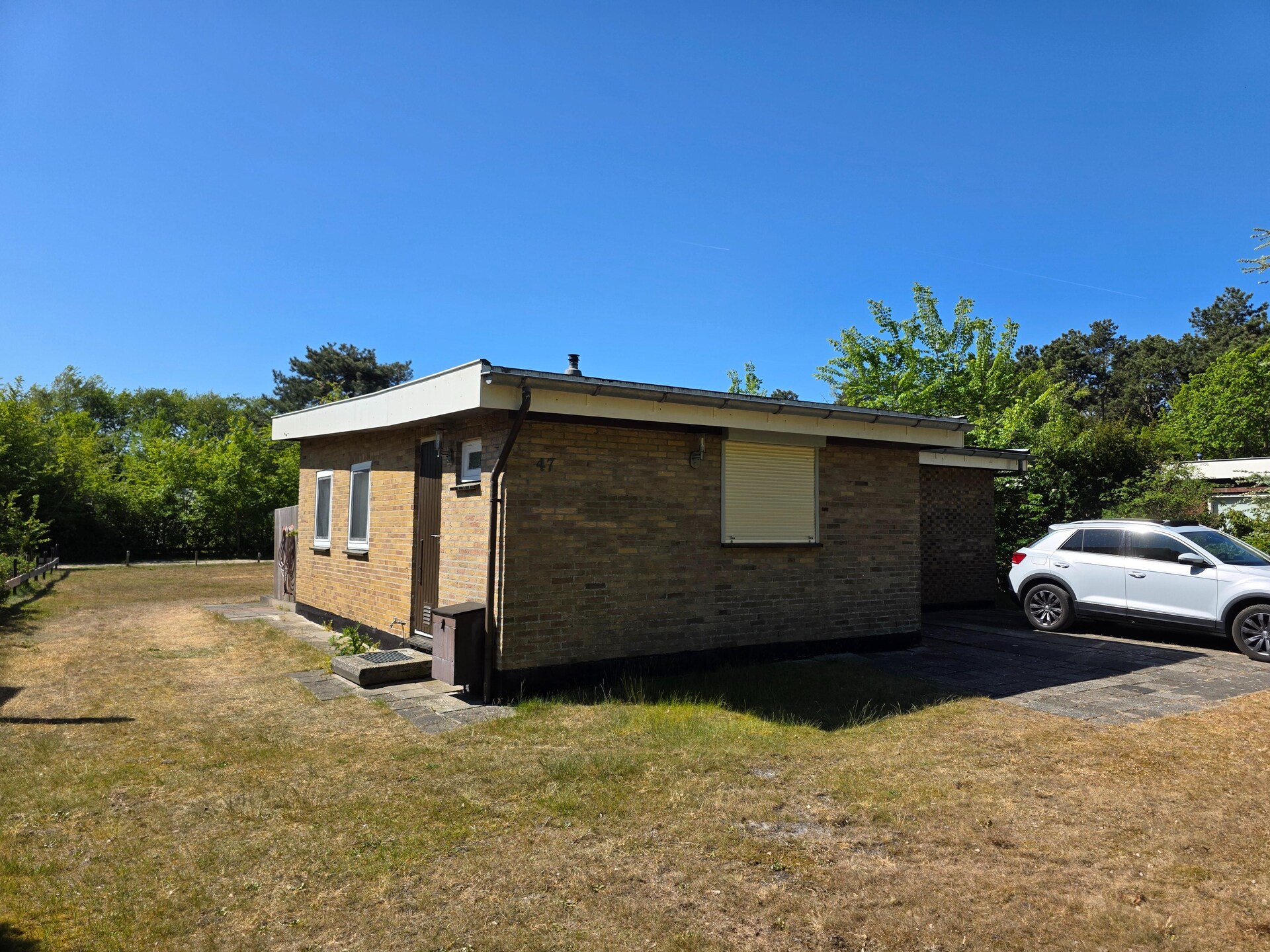 Vrijstaande familiebungalow met zonnige tuin in het bos bij De Koog - foto 14