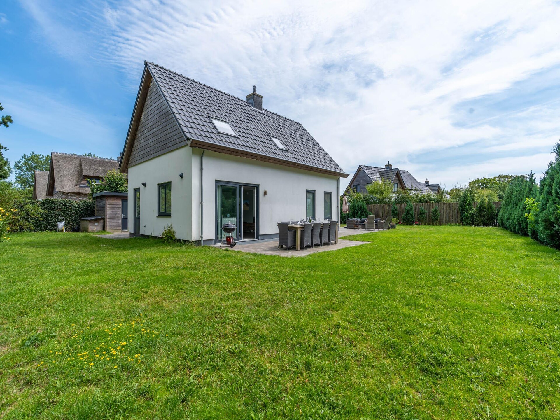Luxe 10-persoons villa met sauna in bosrijke omgeving van De Koog - foto 2