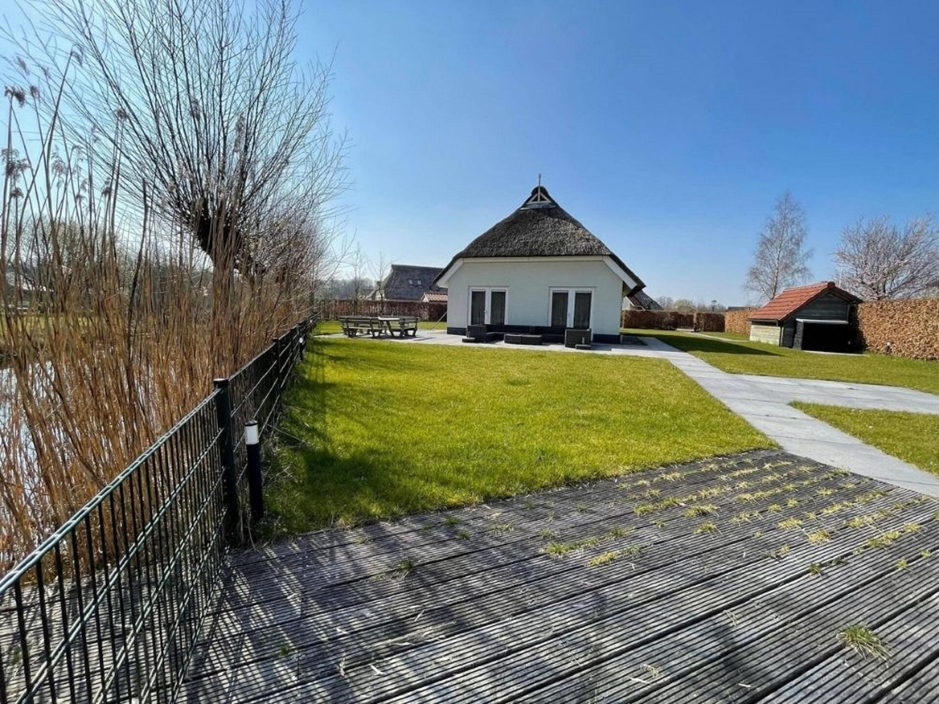 Luxe vrijstaande boerderij aan water met tuin van 1000 m² - foto 17