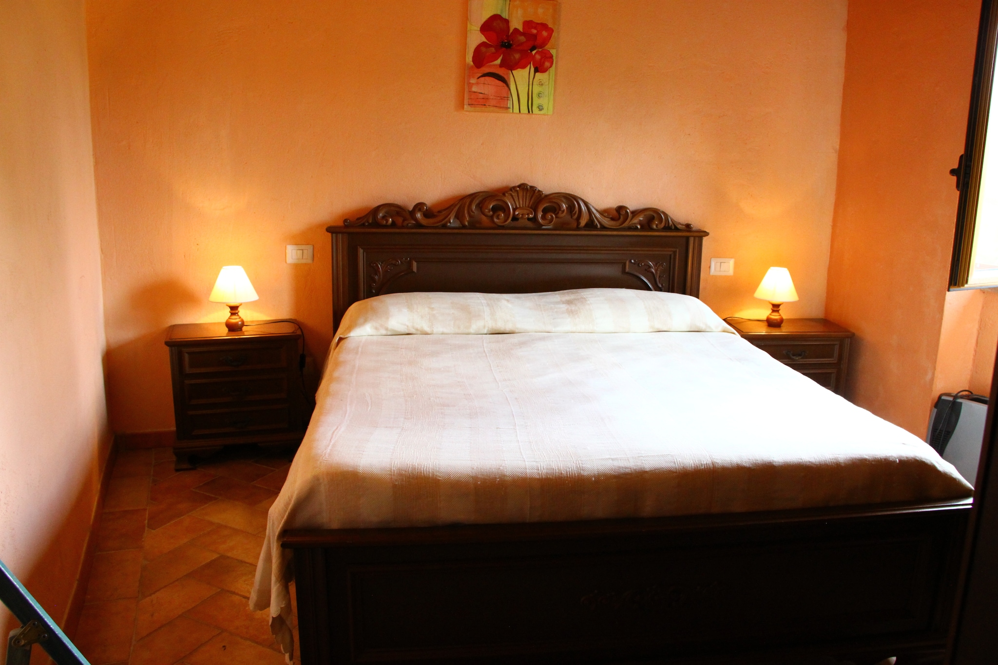 Nestled in the picturesque countryside of Tuscany, this charming holiday home offers an idyllic escape for two. Located in Mulazzo, it perfectly blends rustic charm with modern comforts. Surrounded by lush forests and rolling hills, the property provides a serene retreat for travelers seeking relaxation and tranquility. The inviting interiors, including a cozy living room with a wood stove, create a warm and welcoming atmosphere. Whether enjoying the peaceful ambiance on the private patio or venturing into nearby landscapes, this holiday home is the perfect gateway to Tuscanyâ€™s natural beauty.

Designed with convenience and comfort in mind, this property boasts a well-equipped kitchen with a ceramic stove and oven, a charming bedroom, and a stylish bathroom complete with a shower and bidet. Guests can unwind in the shared TV room or enjoy leisurely moments in the garden. Outdoor enthusiasts will love the natural swimming pond, barbeque area, and relaxation zone, while playful visitors can enjoy table football and nearby play equipment. Bicycles are available for rent, offering the perfect way to explore the scenic surroundings.

History lovers can explore the ancient villages and castles, visit the Statue Menhir Museum in Pontremoli, or discover the Ethnographic Museum in Villafranca. For coastal adventures, Cinque Terre, Lerici, and Portovenere are within an hourâ€™s drive, offering stunning seaside escapes. Food enthusiasts can indulge in authentic Tuscan cuisine at nearby restaurants just 4 km away, savoring local specialties that define the regionâ€™s rich gastronomic heritage.