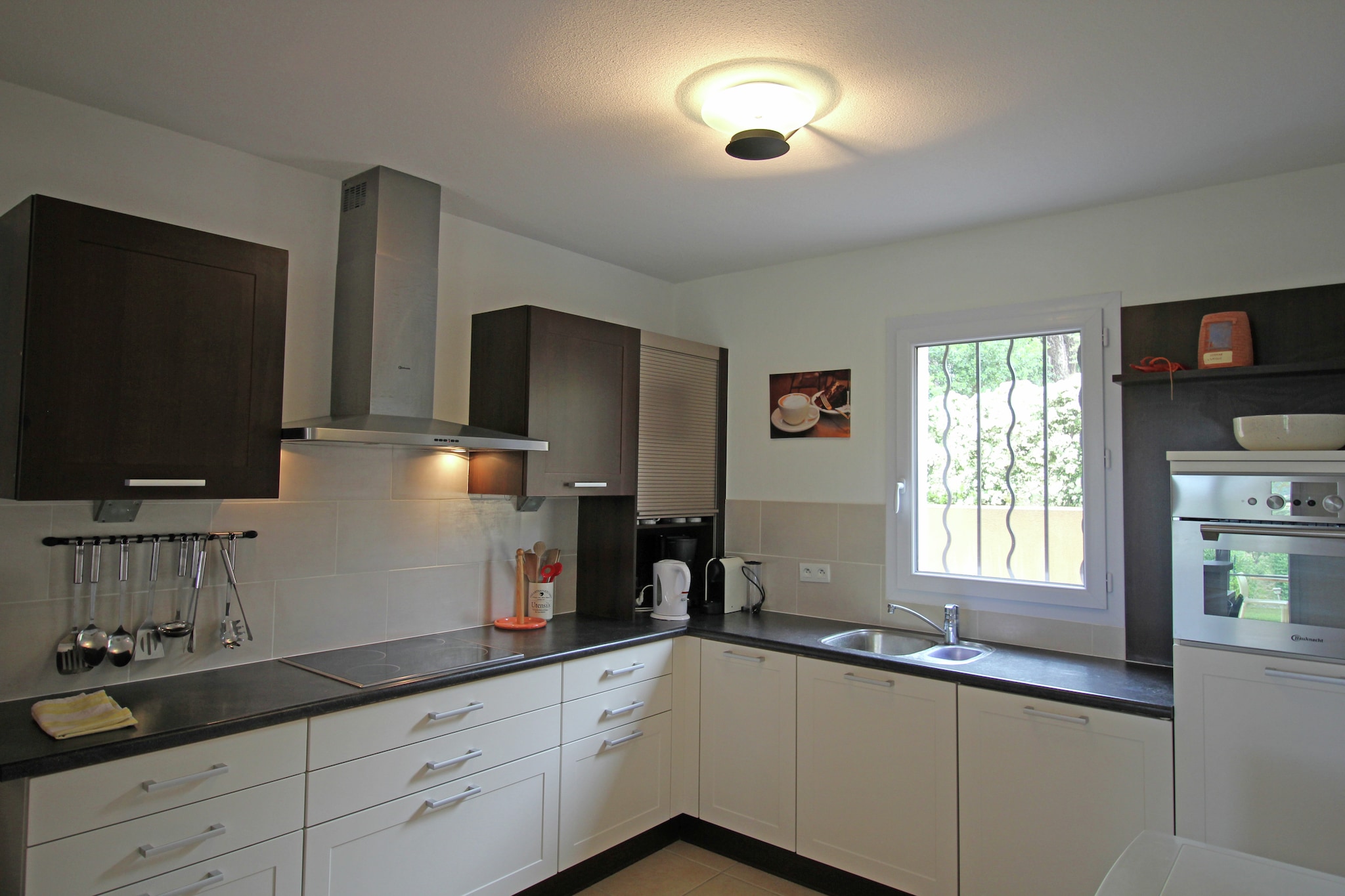 Ground floor: (Sitting room(TV(satellite), DVD player, radio, CD player, stereo unit), open kitchen(cooker(ceramic), coffee machine(filter), oven(grill-oven), dishwasher, fridge, washing machine), Living/diningroom(dining table(6 persons)), toilet)\n\nmezzanine: \n\nOn the 1st floor: (bedroom(double bed or 2 single beds, air conditioning), bedroom(bunk bed, air conditioning), Bedroom with bathroom(double bed or 2 single beds, shower, air conditioning), bathroom(shower))\n\ntoilet, garage, streamingservice, microwave, cot, heating(central), air conditioning, terrace(private, 22 m2), garden(private), garden furniture, sun loungers, BBQ, parking, deckchairs, parasol, swimming pool(shared with other guests, fenced, 13 x 6 m., opened from May upto and including Sep), bicycles available, ironing board, party games