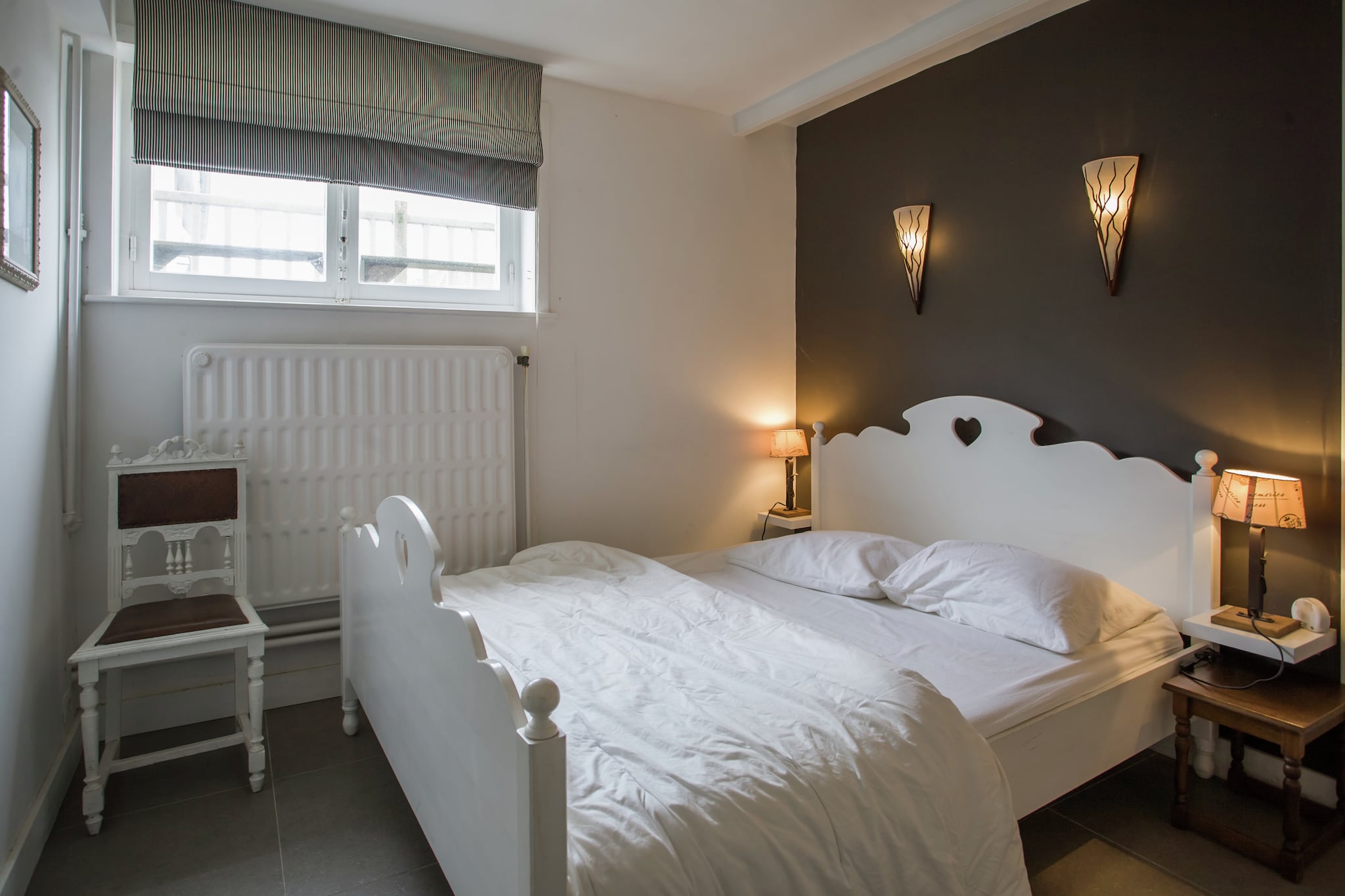 Ground floor: (hallway, Kitchen(coffee machine, oven, microwave, dishwasher, fridge-freezer), Living/diningroom(TV, balcony), Bedroom with bathroom(double bed(180 x 200 cm), TV, bath tub, washbasin, toilet))\n\nOn the 1st floor: (bedroom(bunk bed(90 x 200 cm), small double bed(140 x 200 cm), TV), Bedroom with bathroom(double bed(180 x 200 cm), TV, shower), Bedroom with bathroom(2x single bed(90 x 200 cm), shower), bathroom(bath tub, washbasin, toilet, balcony or terrace), toilet)\n\nOn the 2nd floor: (bedroom(double bed, children\'s bed), bedroom(2x single bed(90 x 200 cm)), bedroom(2x single bed(90 x 200 cm)), toilet)\n\nBasement: (Bedroom with bathroom(small double bed, shower, infrared sauna, washbasin, toilet), recreation room(TV), tumble dryer, washing machine, balcony or terrace)\n\nbathtub or shower, patio, heating, terrace, garden furniture, sun loungers, BBQ, parking, deckchairs, children\'s bed, 2x high chair, ironing board, party games