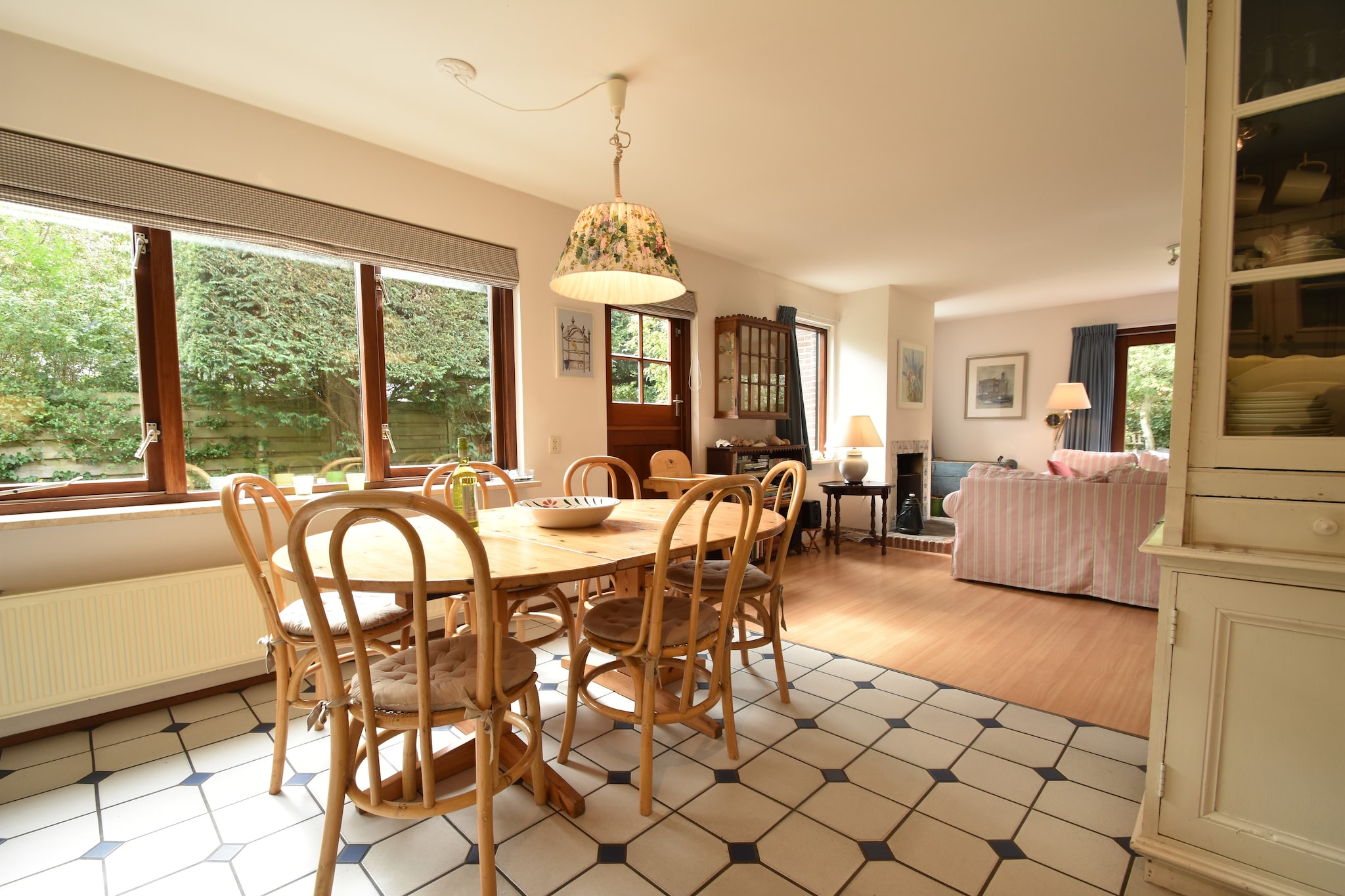 Ground floor: (hallway(toilet), open kitchen(electric kettle, cooker, coffee machine, oven, microwave, dishwasher, fridge-freezer, high chair), Living/diningroom(TV(flatscreen), dining table(7 persons), fireplace, seating area, DVD player, radio, CD player), bedroom(2x single bed), bedroom(2x single bed), bedroom(small double bed(140 x 200 cm), washbasin), bedroom(bunk bed), bathroom(bath tub, shower, washbasin, toilet), bathroom(shower, washbasin, washing machine), pantry(oven(grill-oven), microwave), heating(central), terrace(fire place, 20 m2), terrace(14 m2), garden(fenced, 500 m2), bicycle storage, garden furniture(7 persons), parking, deckchairs, parasol, parasol, lounge set)\n\nAttic: (tumble dryer, stair gate)