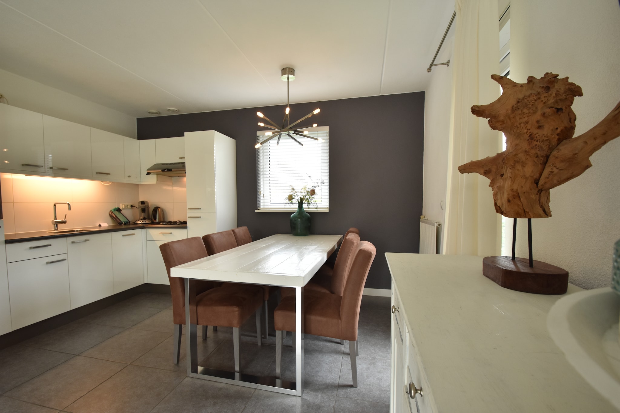 Ground floor: (open kitchen(cooker(gas), combination microwave, dishwasher, fridge-freezer), Living/diningroom(TV(flatscreen), dining table(8 persons), DVD player, stereo unit), bedroom(2x single bed, TV(flatscreen)), bathroom(sun shower), toilet)\n\nOn the 1st floor: (bedroom(4x single bed), bedroom(double bed), bedroom(2x single bed), bathroom(bathtub or shower))\n\nsauna, jetty, sun shower, sauna, garden doors, terrace(20 m2), terrace, garden, bicycle storage, garden furniture(8 persons), parking, deckchairs, parasol, bicycles available, lounge set