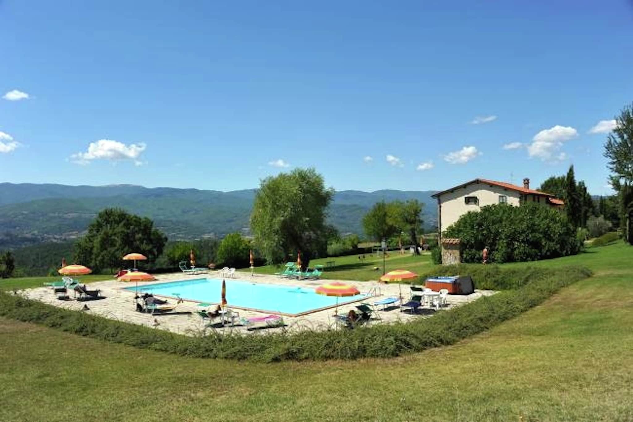 An optional utilities and service fee of EUR 80,00 will be charged before your arrival. Details are given below.<br> This authentic Tuscan farmhouse, nestled in the picturesque Casentino valley near Arezzo, offers 9 charming flats, each carefully furnished in traditional Tuscan style. The property spans 12 acres, surrounded by gardens and woods, making it an ideal location for nature walks and relaxation. Guests can enjoy numerous amenities, including a playground, bocce court, table tennis, barbecue, wood-burning oven, swimming pool, Jacuzzi, and covered parking. Additionally, homemade ham and salami made from the farm's pigs are available for purchase. The Casentino valley, with its blend of historical, religious, and artistic heritage, is an area of breathtaking natural beauty. The landscape is defined by mountains, valleys, lakes, and forests, making it a paradise for nature lovers. The National Park of the Casentino Forests and Mount Falterona are must-visit attractions, while nearby art cities such as Cortona, Anghiari, and Caprese Michelangelo are easily accessible for day trips. The spacious flat is designed for those seeking comfort and authenticity. It features a fully equipped kitchenette, dining area, and a cozy living space with a sofa bed, satellite TV, and panoramic views of the valley. The two elegantly furnished bedrooms offer peaceful retreats, and the modern bathroom includes a large shower cubicle. Perfect for a relaxing and unforgettable Tuscan holiday, this flat provides the ideal blend of comfort, nature, and tradition. <br><b> Optional Utilities & Service Package </b><br><b> An optional utilities and service package of EUR 80,00 </b> can be selected prior to your arrival. You will receive a separate communication with the payment link should you wish to include it.<br>This package ensures a seamless stay and conveniently covers services such as final cleaning, utility consumption, service support, and protection against minor damages or incidental costs during your stay.<br>Guests who prefer may manage these services independently, provided the property is returned in good order at check-out.