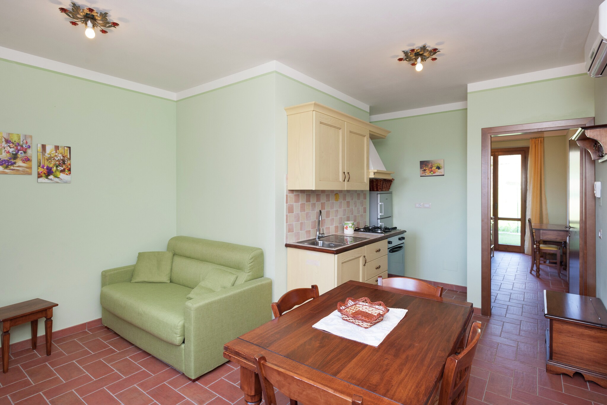 Situated atop a hill in the tranquil village of Monte del Lago, this inviting stay offers a peaceful retreat for four guests. The property provides free Wi-Fi, ensuring a comfortable stay. Just a short distance away, Lake Trasimeno invites visitors to enjoy its serene waters, picturesque landscapes, and outdoor activities like boating and hiking.
The home features a cozy ground floor with a spacious living room, complete with a double sofa bed and satellite TV. The open kitchen provides convenience for meal preparation, while the main bedroom boasts a comfortable double bed. The bathroom includes a shower, washbasin, toilet, and bidet. Additional amenities include a shared washing machine, air conditioning, and a shared garden with furniture. Guests can enjoy a barbecue, play equipment, and a table tennis table. The shared swimming pool, open from June to September, offers a refreshing escape during warm months.
Monte del Lago is known for its excellent dining options. Guests can savor delicious meals at nearby restaurants such as Osteria Rosso di Sera, Miralago, Ristorante Montalcino, Ristorante Da Luciano Di Cacciatori, Ristorante Il Fischio Del Merlo, and Casa Corsetti - Locanda, each offering exquisite Italian cuisine.