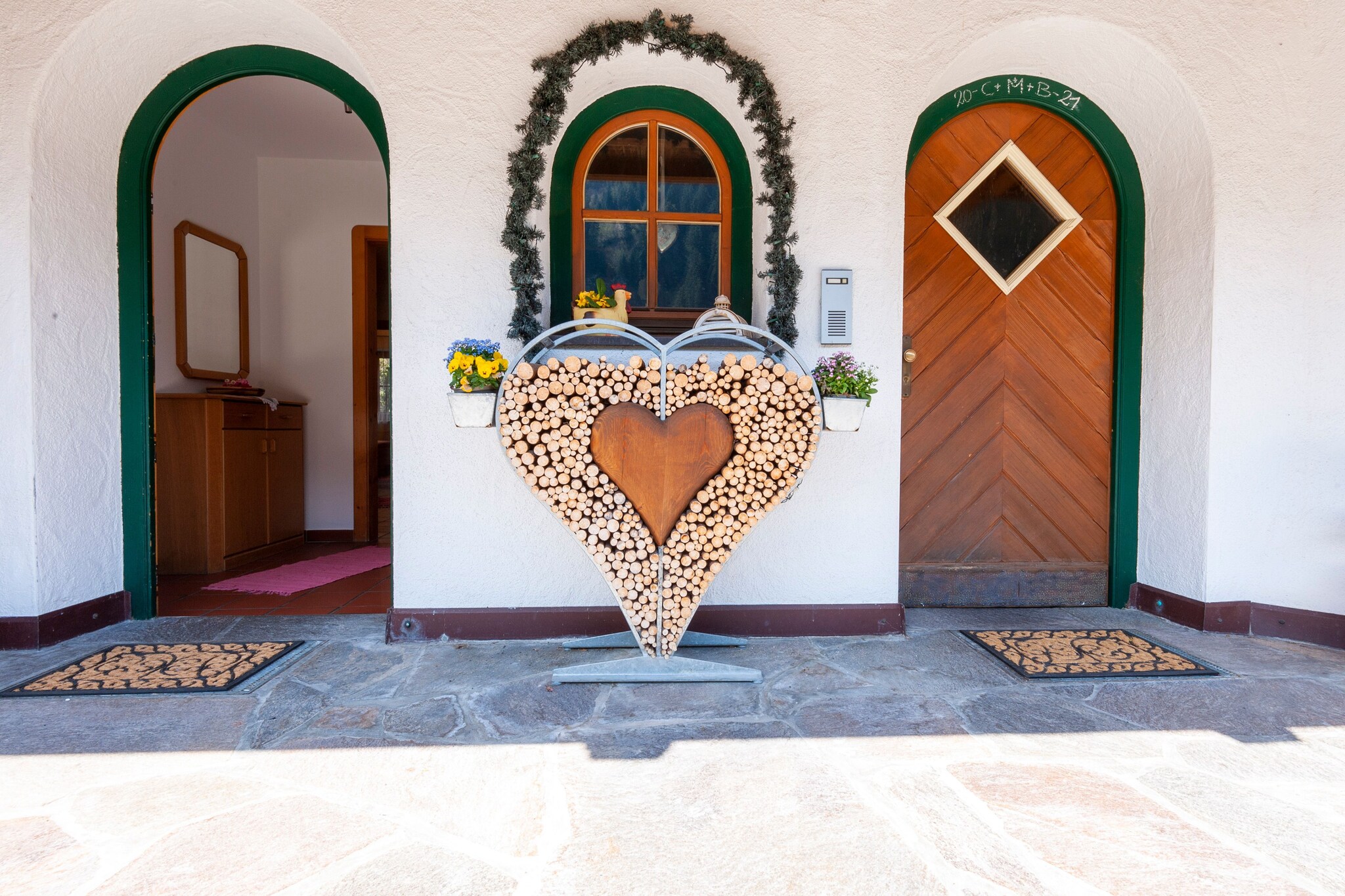 Ground floor: (Living room(TV(satellite), seating area), open kitchen(oven), bedroom(double bed), bedroom(accessible via interconnecting room)(bunk bed), bathroom(shower, washbasin, toilet), toilet)\n\nheating(central), terrace, garden furniture, parking