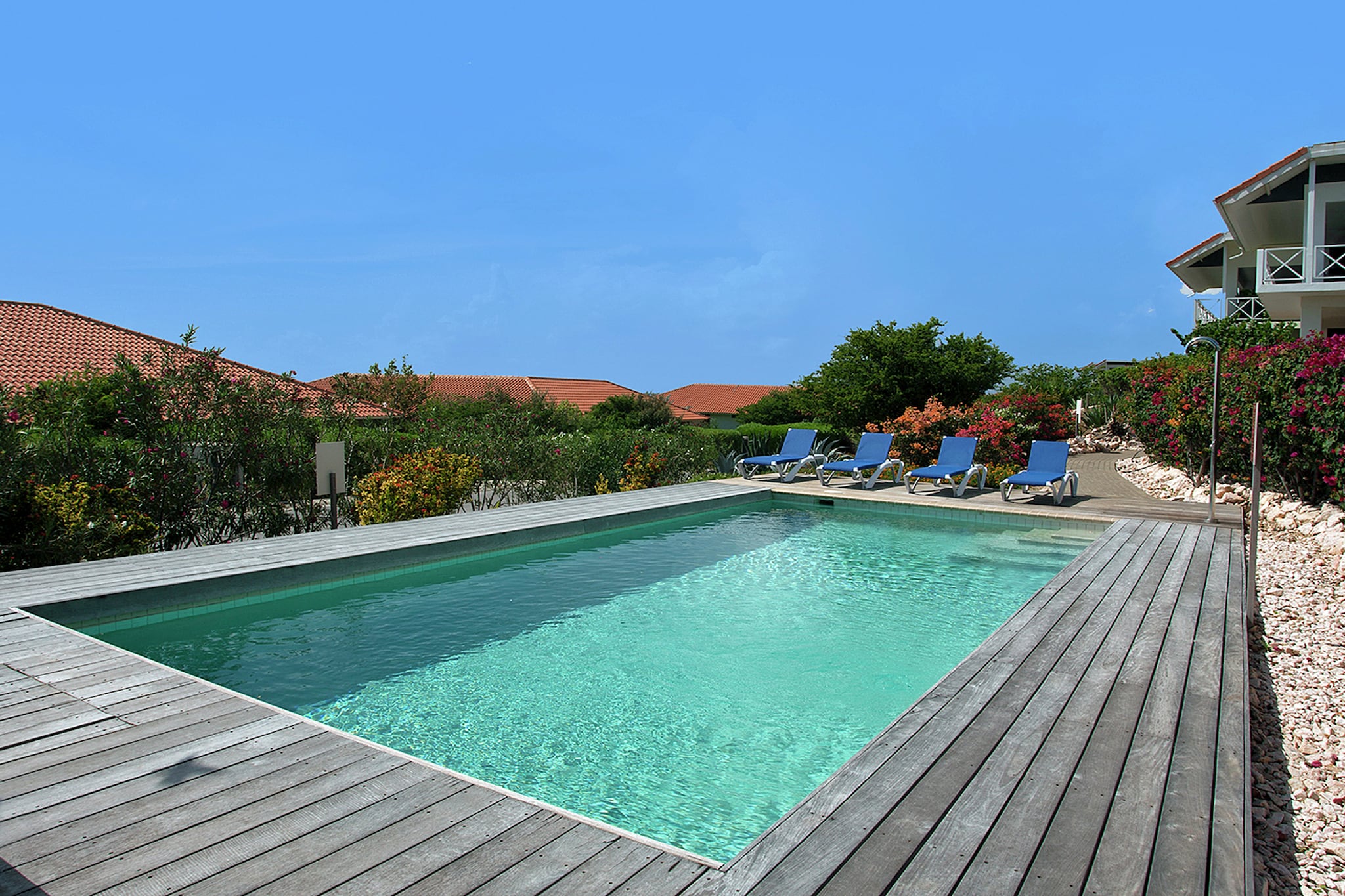 The gorgeous 3 bedrooms apartment for 6 persons is located in the Boca Gentil luxury resort in the famous Jan Thiel Jan Thiel, is the perfect accommodation for family and groups.
From the house, you can enjoy the spectacular view of the Caribbean sea and a refreshing dive in the pool. The beautiful apartment is only 100 m from the Caribbean sea and 200 m from public transport. Daily supplies is about 300 m, everything you need is nearby from the apartment.
The beautiful apartment has 3 well-furnished bedrooms, 2 bathrooms, an open kitchen, a beautiful terrace, where you can enjoy the fresh air and a spacious living/dining room with large dining table for 6 persons and maintained with all entertaining and necessary items. The holiday home provides the facility of free WiFi, beautiful garden, a spacious veranda, stylish garden furniture, air conditioner, a quiet swimming pool, where you can take a refreshing dive and spacious parking.