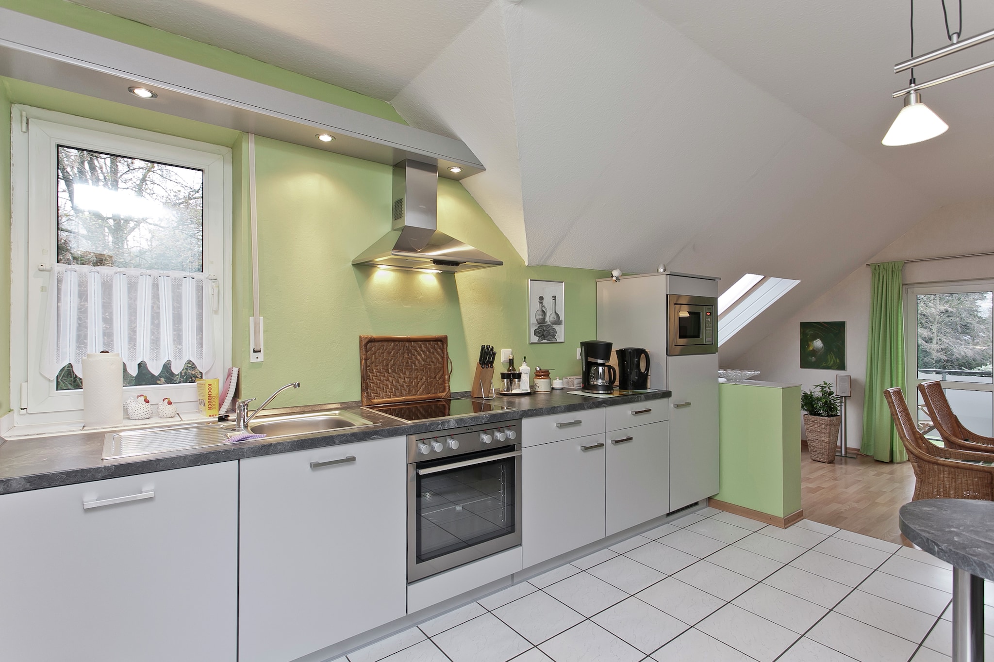 On the 1st floor: (Entrance(hood), open kitchen(toaster, cooker(4 ring stoves, ceramic, electric), coffee machine(filter), oven, waffle iron, microwave, dishwasher, fridge(+ freezer)), Living/diningroom(TV(satellite), radio, CD player, stereo unit), bedroom(double bed(150 x 180 cm)), bathroom(shower, washbasin, toilet), Landing)\n\nSitting room(shared with the owner ), garage, tumble dryer(shared with the owner , paid), cot, washing machine(shared with the owner , paid), balcony, heating(floor heating, oil), terrace(shared with the owner , roofed, 30 m2), garden(shared with the owner , fenced, 300 m2), bicycle storage, garden furniture, BBQ(gas), parking, deckchairs, parasol, play equipment, ironing board, iron