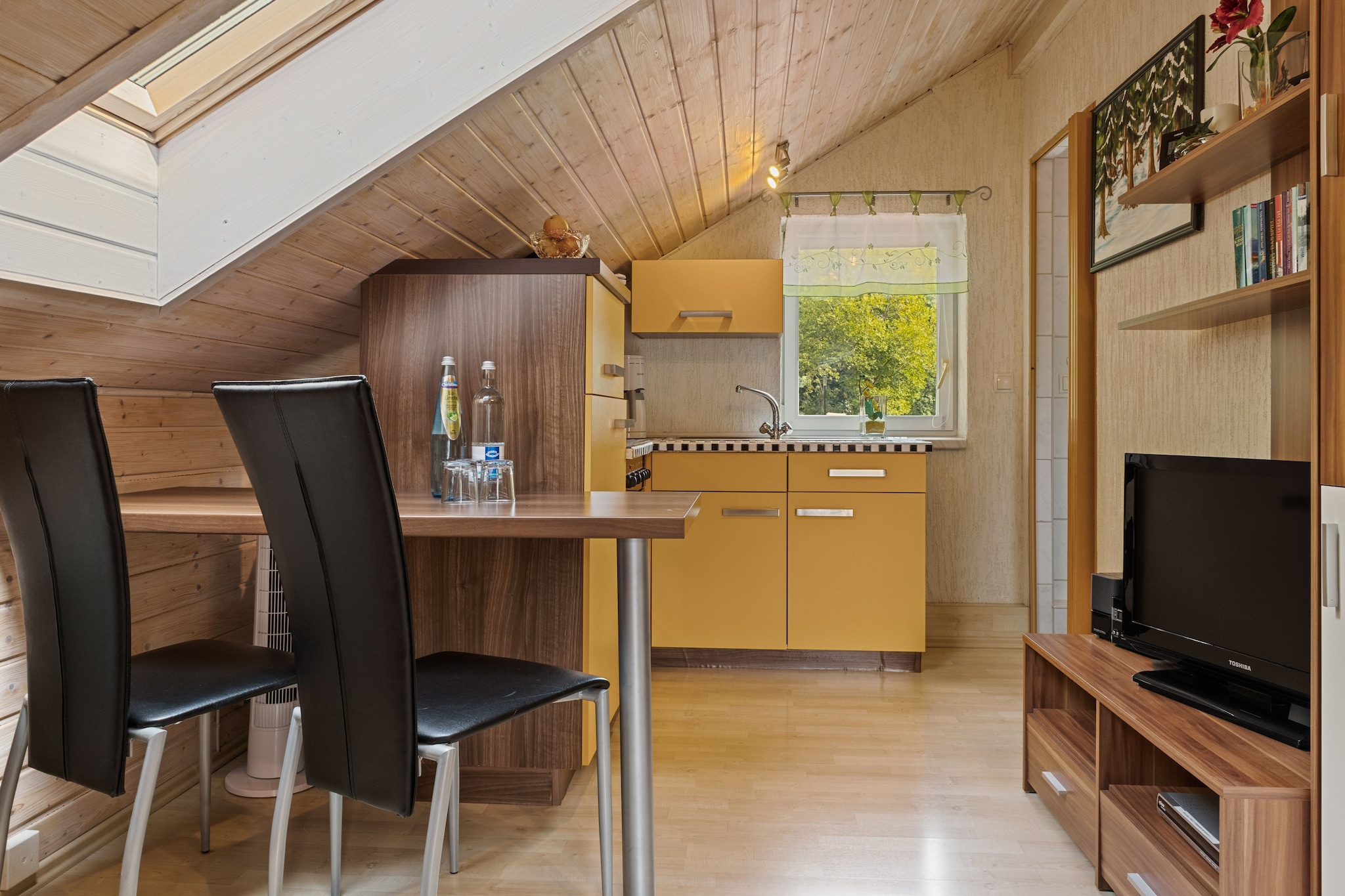 Attic: (open kitchen(dining table, cooker(4 ring stoves), coffee machine, oven, fridge), Living/diningroom(single sofa bed, TV, stereo unit), bedroom(single sofa bed, double bed), bathroom(shower, washbasin, toilet))\n\nstove, grill, heating(electric), terrace(private), garden, garden furniture, sun loungers, BBQ, parking, deckchairs, parasol