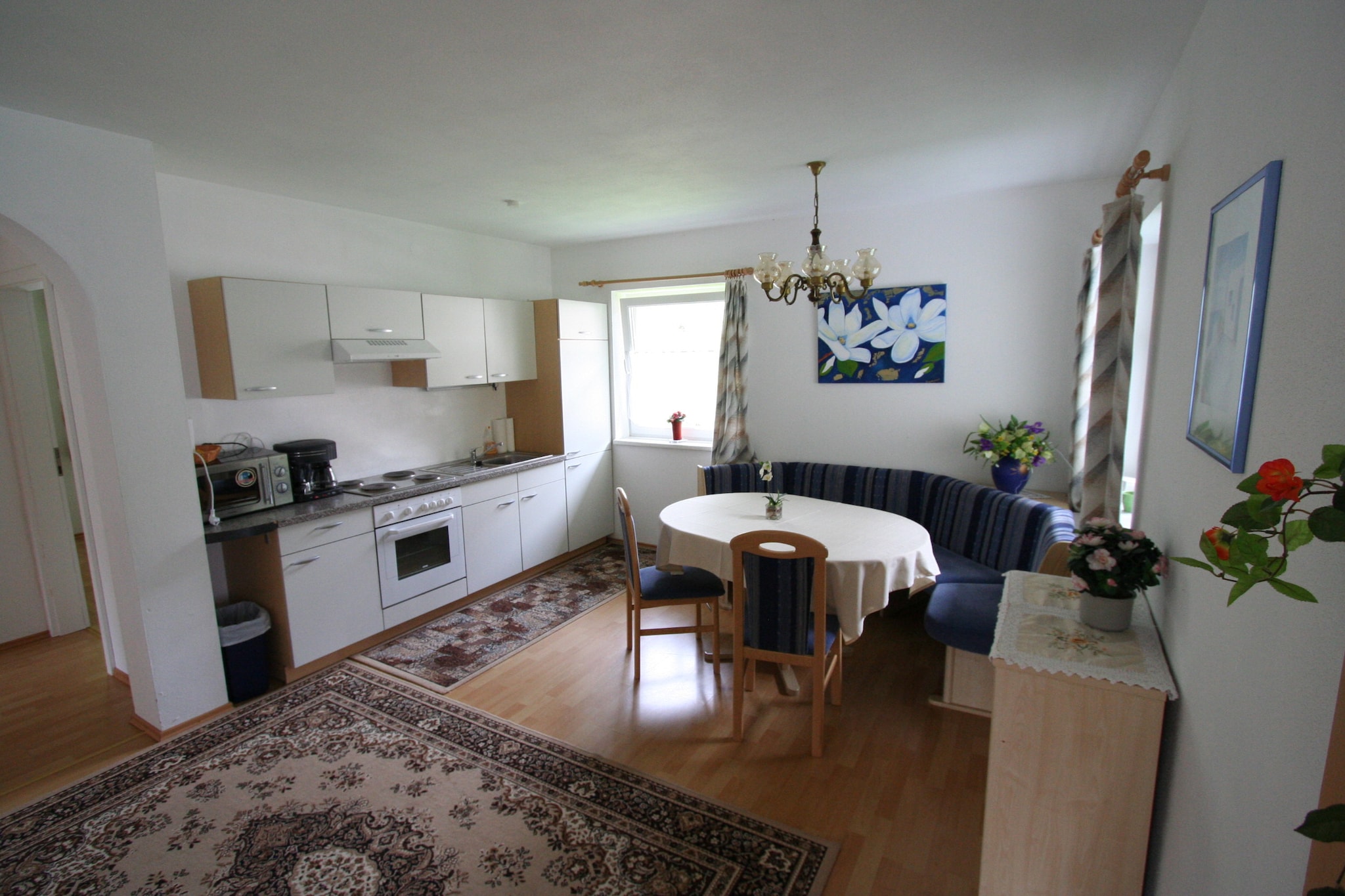 On the 1st floor: (hall, Living room(double sofa bed, TV), open kitchen(hob, toaster, coffee machine, oven), bedroom(double bed), bedroom(double bed), bathroom(shower, washbasin, toilet))\n\nroof terrace, garden furniture, parking