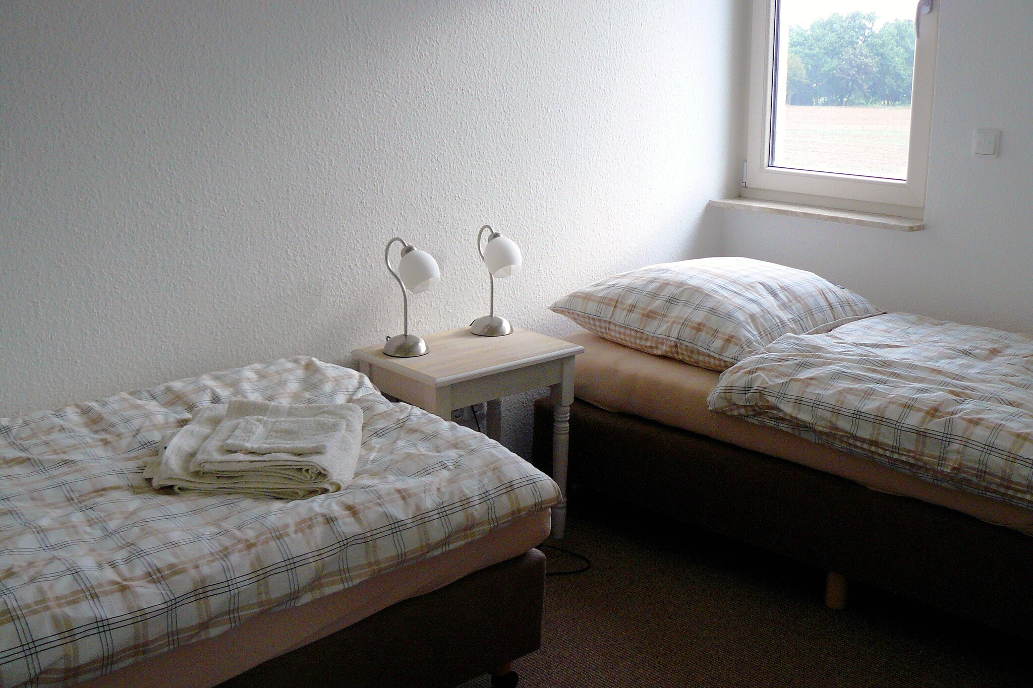 Ground floor: (hallway, open kitchen(cooker(4 ring stoves), oven, microwave, dishwasher, fridge-freezer), Living/diningroom(TV(satellite), DVD player), toilet, storage)\n\nOn the 1st floor: (bedroom(double bed), bedroom(double bed), bedroom(single bed), bathroom(shower, washbasin, toilet))\n\nheating(central, floor heating), terrace, garden, garden furniture, parking, children\'s bed, high chair