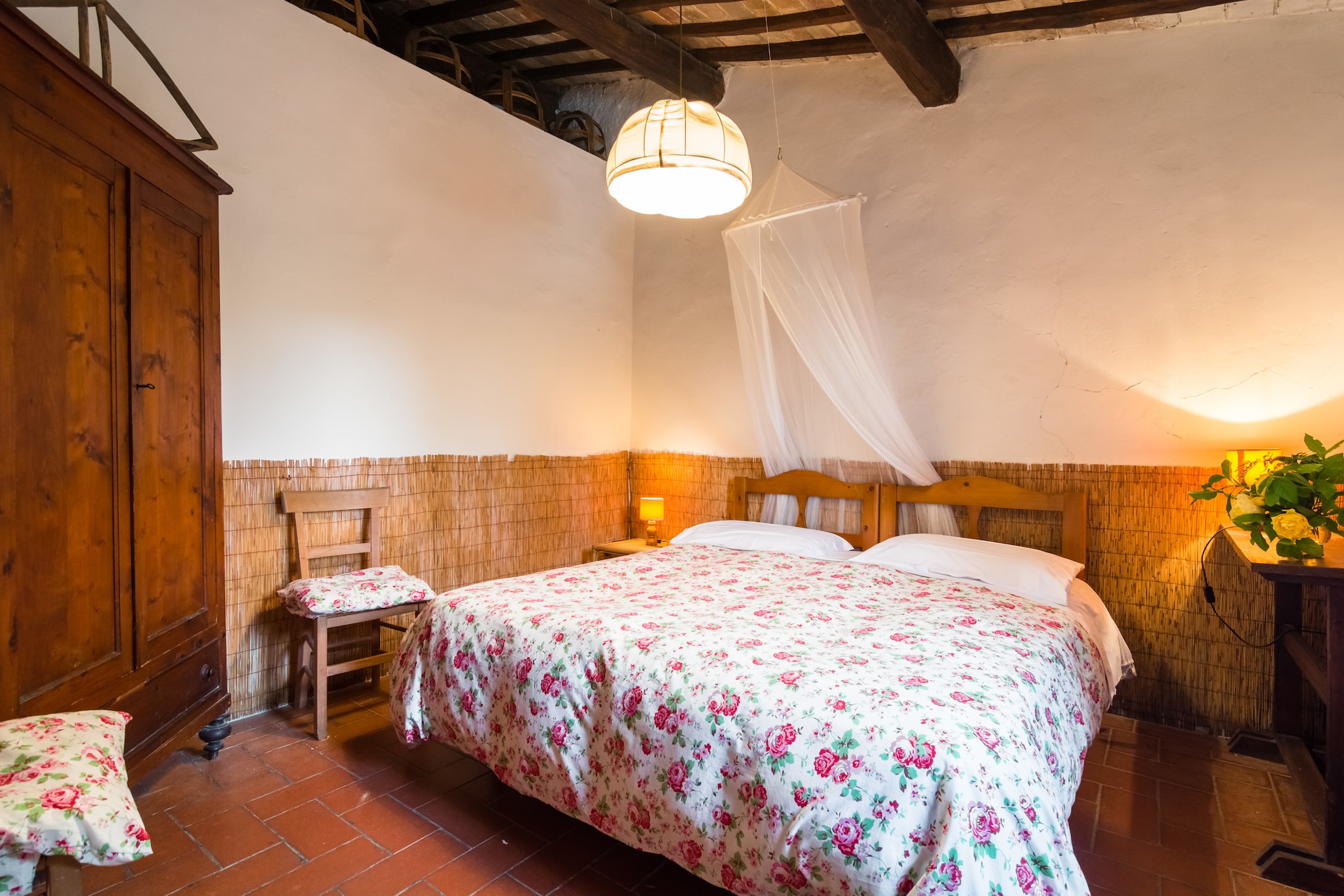 Nestled in the picturesque countryside of Carmignano, this farmhouse for four guests offers a tranquil escape surrounded by rolling hills and vineyards. Located just 2 km from Bacchereto and 5 km from Seano, this charming retreat provides free WiFi, a shared swimming pool (9 x 6 m, open June–September), and a lush garden, ensuring relaxation and comfort. Whether you're enjoying the peaceful surroundings or exploring nearby attractions, this farmhouse is perfect for a rejuvenating getaway.

The ground floor features a cozy living room with a fireplace and dining table, a fully equipped kitchen, and a bedroom with a double bed and en-suite bathroom with a bathtub. The first floor includes an additional bedroom with a double bed, ensuring ample space for guests. Additional amenities include a washing machine, a private terrace, and garden furniture, making it ideal for a comfortable stay.

Nearby, Villa Medicea La Ferdinanda showcases stunning Renaissance architecture, while Museo Leonardiano di Vinci offers fascinating insights into Leonardo da Vinci’s inventions. Explore Emperor Castle in Prato, a medieval fortress with breathtaking views. For dining, La Vinsantaia di Capezzana serves exquisite Tuscan cuisine, while Osteria I Ficarello offers authentic local flavors. Whether discovering history or savoring traditional dishes, this farmhouse is the perfect retreat.