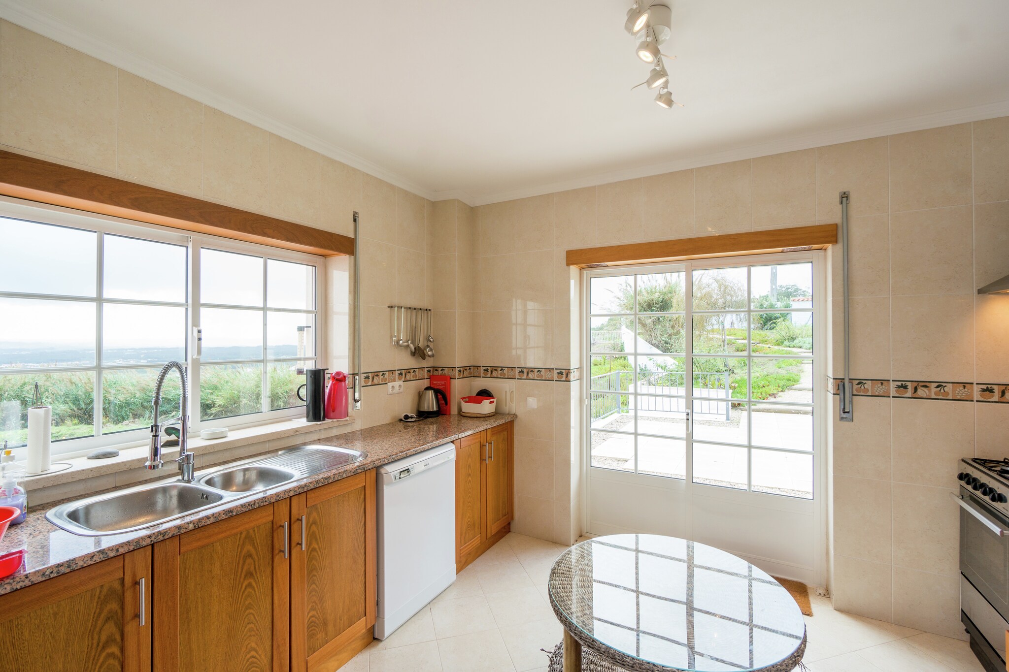 Ground floor: (hall(toilet), Living room(stereo unit), dining room, open kitchen(cooker(4 ring stoves), oven, microwave, dishwasher, fridge-freezer, washing machine), balcony or terrace, terrace, parking)\n\nOn the 1st floor: (bedroom(double bed), bedroom(2x single bed, stove), bathroom(shower, washbasin, toilet))\n\nfireplace, coffee machine, bathtub or shower, shower, heating, garden(private, fenced), garden furniture, sun loungers, BBQ, deckchairs, parasol, ironing board, party games