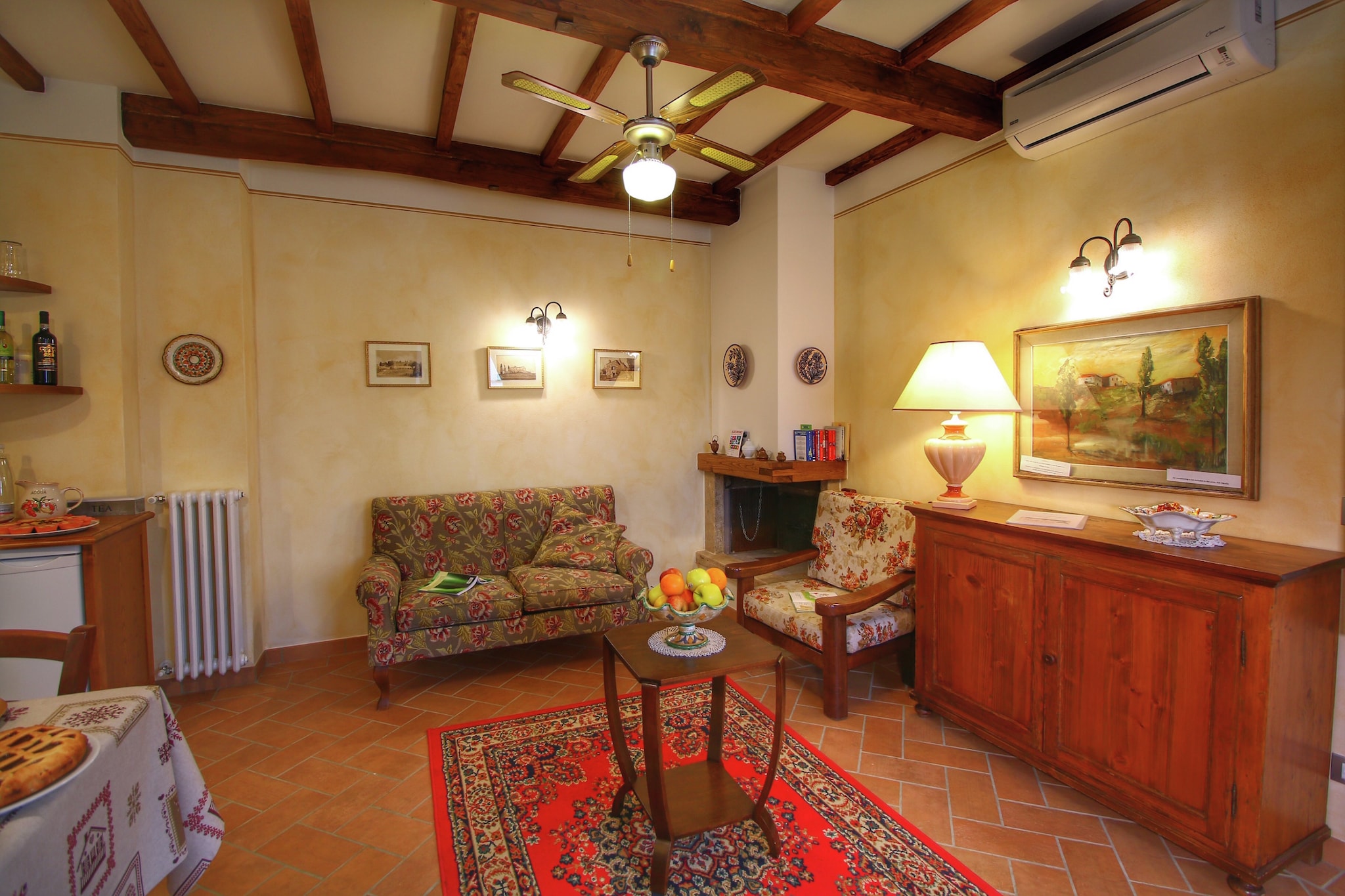 Located near Lucignano in the heart of Tuscany, Apartment Noceto offers a peaceful escape surrounded by nature. This charming cottage is just a short drive from Arezzo, Siena, Florence, and even the region of Umbria, making it an excellent base for cultural day trips. Furnished in a traditional Tuscan style, the home provides a warm and welcoming atmosphere for up to 4 guests, complete with WiFi and air conditioning.

The house is enveloped by a spacious garden filled with fruit trees and offers scenic views over the rolling Tuscan hills. Guests can relax by the shared, fenced swimming pool or enjoy al fresco meals under the gazebo. A barbecue area, garden furniture, and a partially fenced private space create the perfect setting for laid-back evenings. The owners, who live on-site, maintain the barbecue daily and are happy to offer warm hospitality year-round.

Inside, the home features a cozy living room with a decorative fireplace, a well-equipped kitchen, two bedrooms (one with a double bed and the other with twin beds), and two bathrooms, one with a bathtub and the other with a shower. Guests can also enjoy leisure time with a game of table football or billiards. For a special experience, olive oil tastings and Italian cooking classes can be arranged directly with the homeowner.