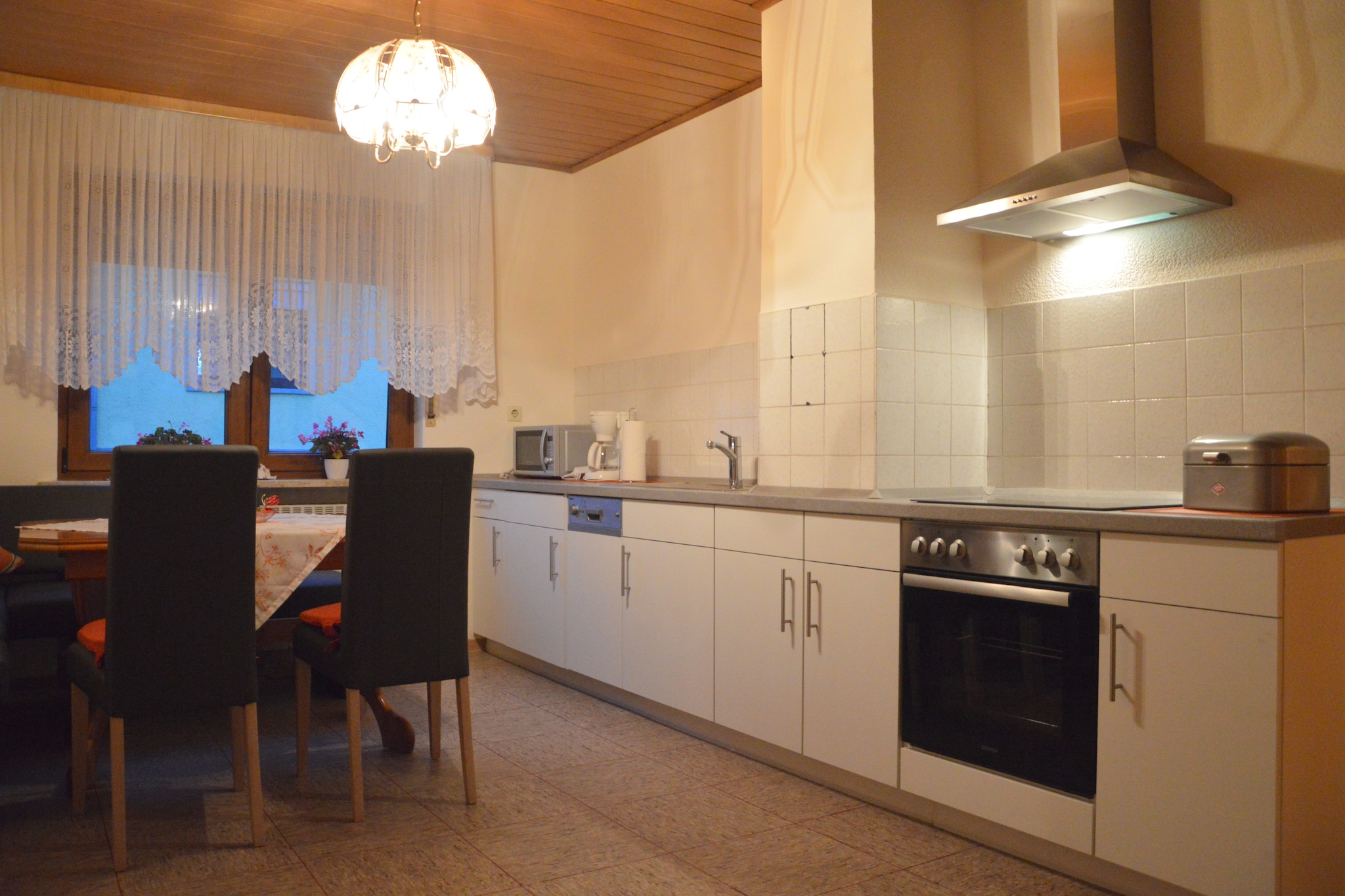 Ground floor: (hallway, Living room(TV), Large kitchen(dining table, radio, cooker(4 ring stoves, ceramic), hood, coffee machine(filter), oven, microwave, dishwasher, fridge-freezer), bedroom(double bed), bathroom(shower, washbasin, toilet), pantry(freezer, washing machine))\n\nOn the 1st floor: (bedroom(double bed), bedroom(single bed), Children\'s bedroom(children\'s bed))\n\nterrace, garden, garden furniture, BBQ, parking, children\'s bed, high chair