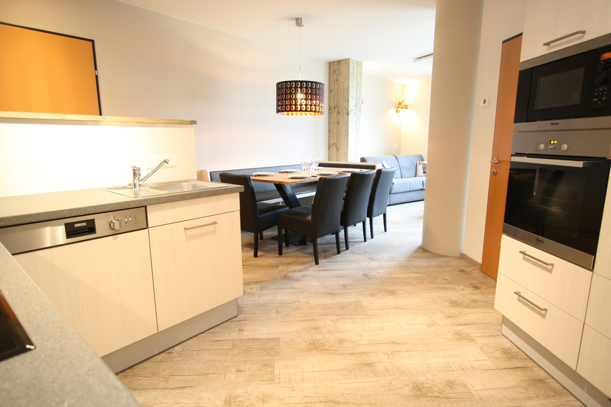 Ground floor: (hallway, Kitchen(cooker(4 ring stoves), oven, microwave, dishwasher, fridge-freezer), Living/diningroom(double sofa bed, TV), bedroom(double bed or 2 single beds), bedroom(2x bunk bed), Bedroom with bathroom(double bed or 2 single beds, shower, washbasin), bathroom(bath tub, shower, 2x washbasin, toilet), toilet)\n\nski storage(ski boot heaters), coffee machine, bathtub or shower, heating(electric), terrace, garden, garden furniture, parking, parasol, children\'s bed