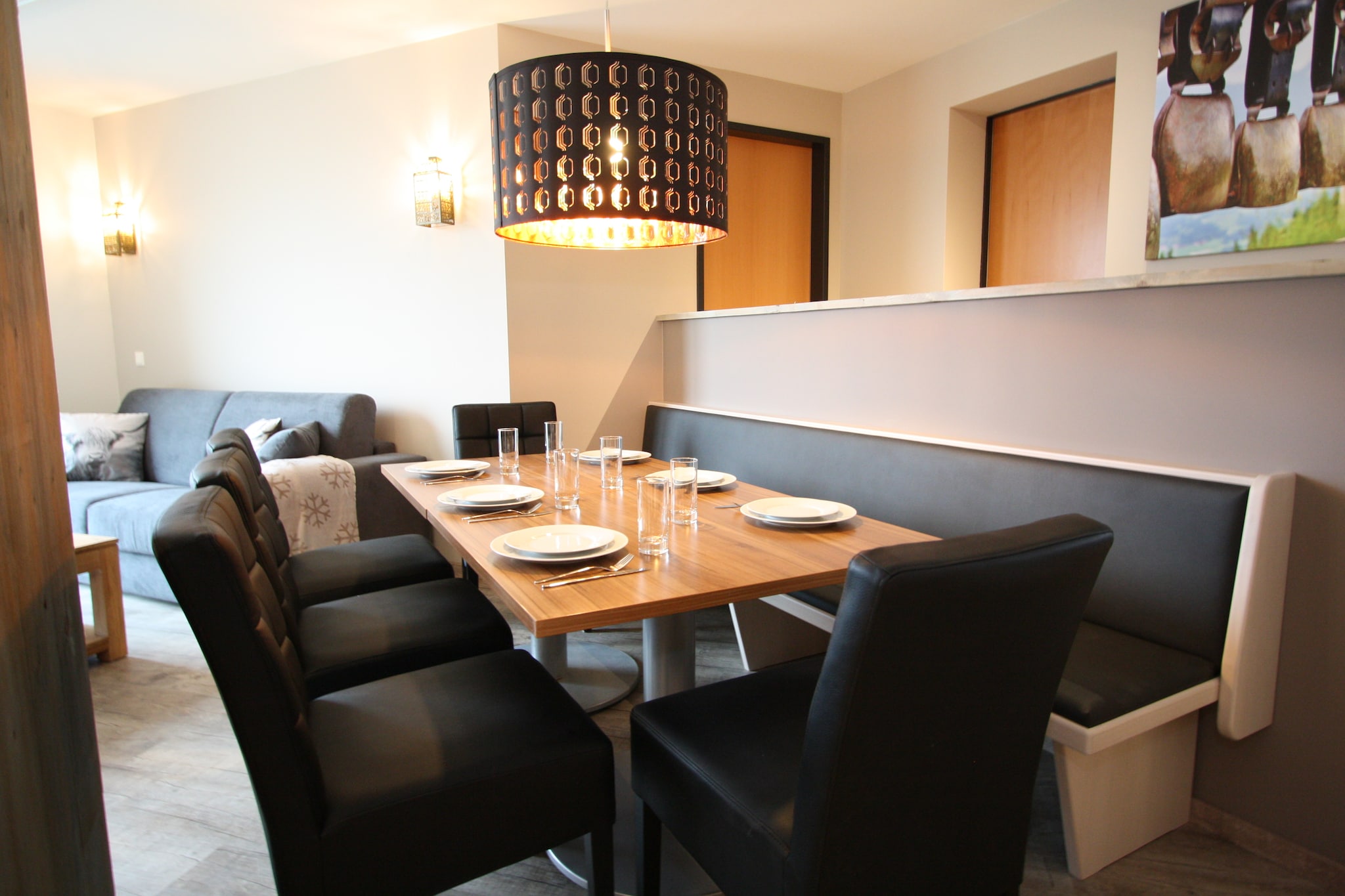 Ground floor: (hallway, Kitchen(cooker(4 ring stoves), combination microwave, dishwasher, fridge-freezer), Living/diningroom(double sofa bed, TV, fireplace), bedroom(double bed), bedroom(2x bunk bed), Bedroom with bathroom(double bed, shower, washbasin), bathroom(bath tub, shower, 2x washbasin, toilet), toilet)\n\nski storage(ski boot heaters), heating(electric), terrace, garden, garden furniture, parking