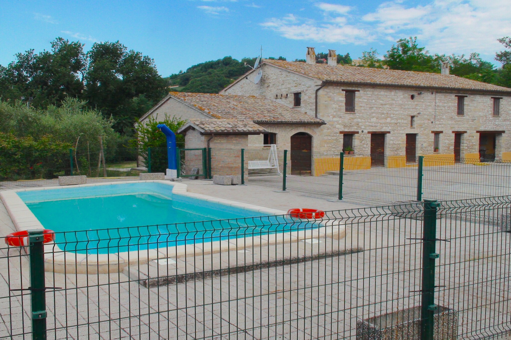 Ground floor: (Living room(double sofa bed, TV, fireplace), Sitting room, Kitchenette(hob, cooker, espresso machine, oven, microwave, dishwasher, fridge-freezer), bedroom(single sofa bed, double bed), bathroom(shower, washbasin, toilet, bidet))\n\nOn the 1st floor: (Living room(double sofa bed, TV, oven, dishwasher, fridge), Living room(double sofa bed, TV, oven, dishwasher, fridge), Kitchenette(hob, cooker, hood, espresso machine, oven, microwave, dishwasher, fridge-freezer), Kitchenette(hob, cooker, hood, espresso machine, oven, microwave, dishwasher), bedroom(double bed), bedroom(double bed), bedroom(single bed(140 x 190 cm), single bed(140 x 190 cm)), Bedroom with bathroom(single sofa bed, double bed, shower, washbasin, toilet, bidet), bathroom(shower, washbasin, toilet, bidet), bathroom(shower, washbasin, toilet, bidet))\n\nGuest house ground floor: (Kitchen(hob, cooker, espresso machine, oven, dishwasher, fridge), Living/diningroom(dining table), bedroom(2x double bed(140 x 180 cm), TV), bathroom(shower, washbasin, toilet, bidet), dining table, patio, garden furniture)\n\ndining table, cot, garden(> 1000 m2), garden furniture, sun loungers, BBQ(charcoal), parasol, swimming pool(private, fenced, 10 x 4 m., opened from Jun upto and including Sep), bicycles available, high chair, Swing set