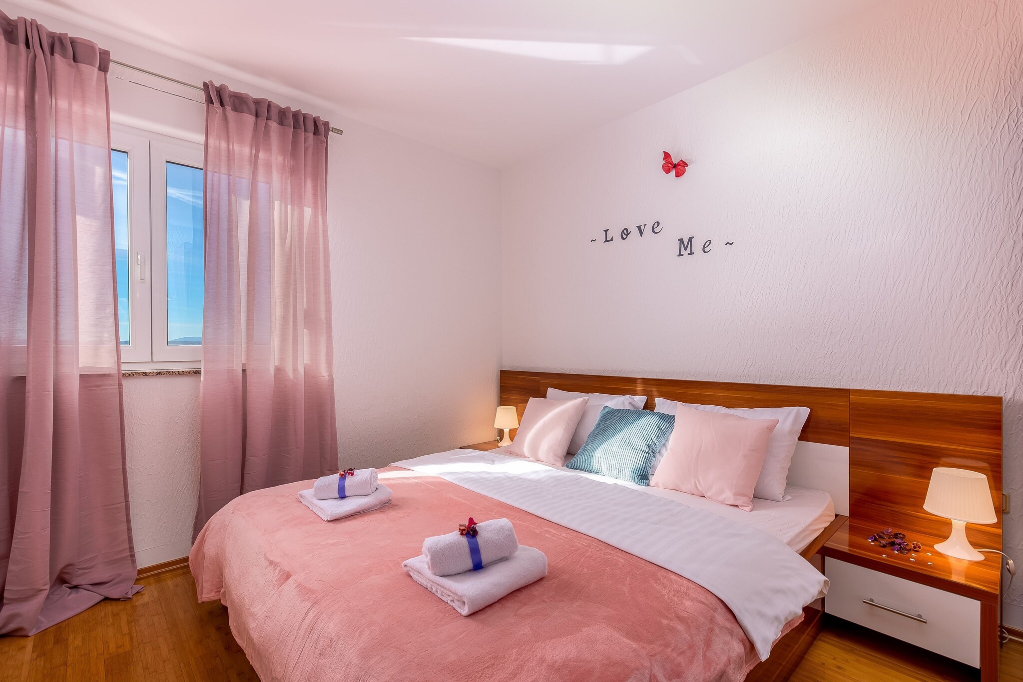 Ground floor: (open kitchen(electric kettle, cooker(4 ring stoves), coffee machine, microwave, fridge-freezer), Living/diningroom(double sofa bed, TV(satellite), balcony, air conditioning), bedroom(double bed, air conditioning), bedroom(2x single bed), bathroom(shower, washbasin, toilet, washing machine, hairdryer))\n\nBubble bath, parking