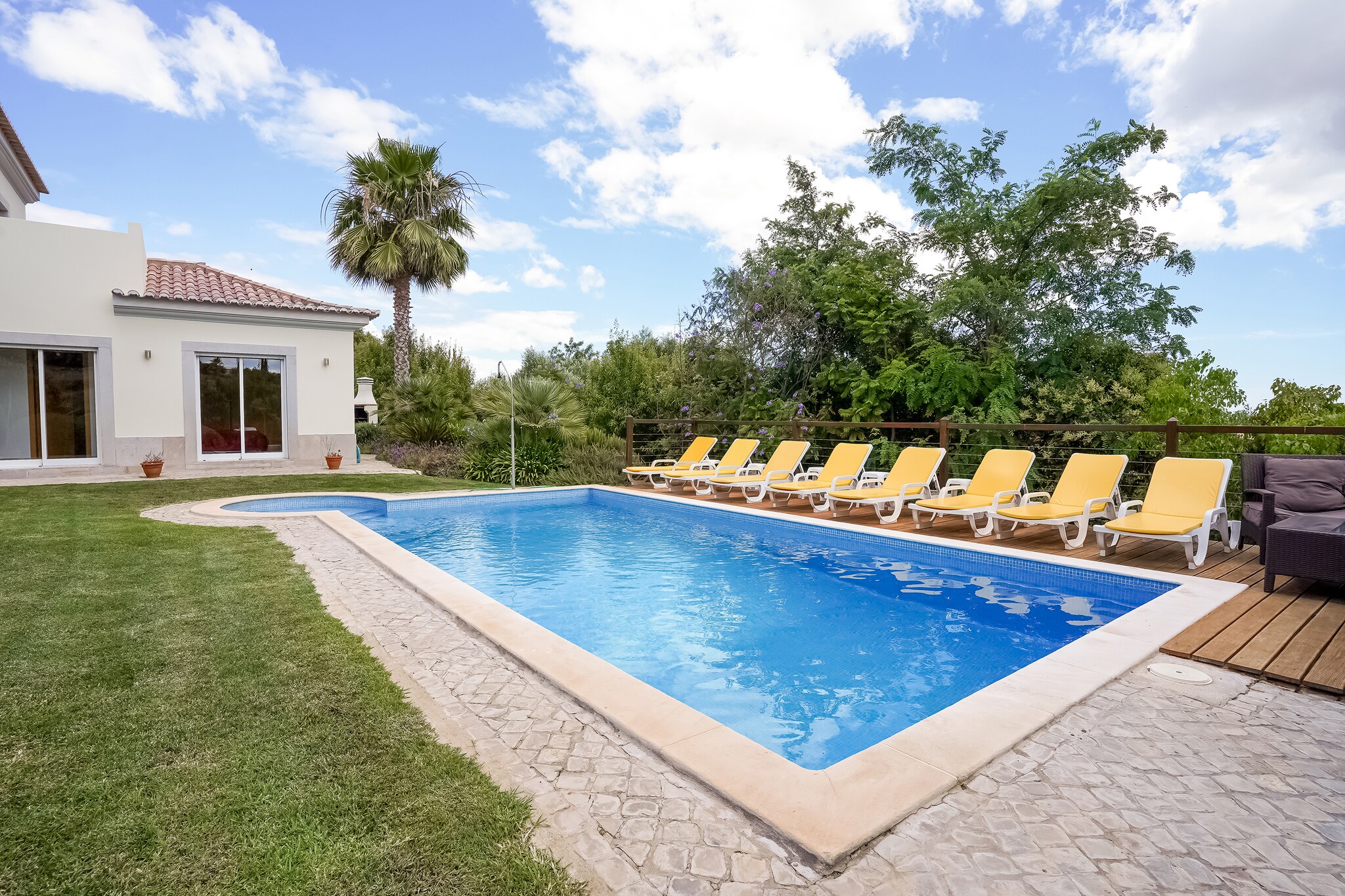This beautiful villa in Tavira has a private swimming pool with sun loungers, and it can accommodate 8 guests. With 4 bedrooms, this home is perfect for families. For reasons of tranquillity, this villa is not rented to groups of youngsters.Tavira has many restaurants (3 km) and supermarkets (3 km). Often considered to be one of the most beautiful places in the Algarve, it also boasts of many bridges, like the elegant Ponte Romana, which is worth a visit. The nearest sea beach - Santa Luzia - is 8 km away.This villa is fully equipped with all comforts and facilities. In the fenced garden with plenty of lounge chairs lies the large private swimming pool and outdoor shower. There is air-conditioning throughout the entire villa. From the living room, the sliding doors open to the partly covered terrace and the garden, where you can enjoy a barbecue too. You can even avail a cot and a high chair for a small fee.
