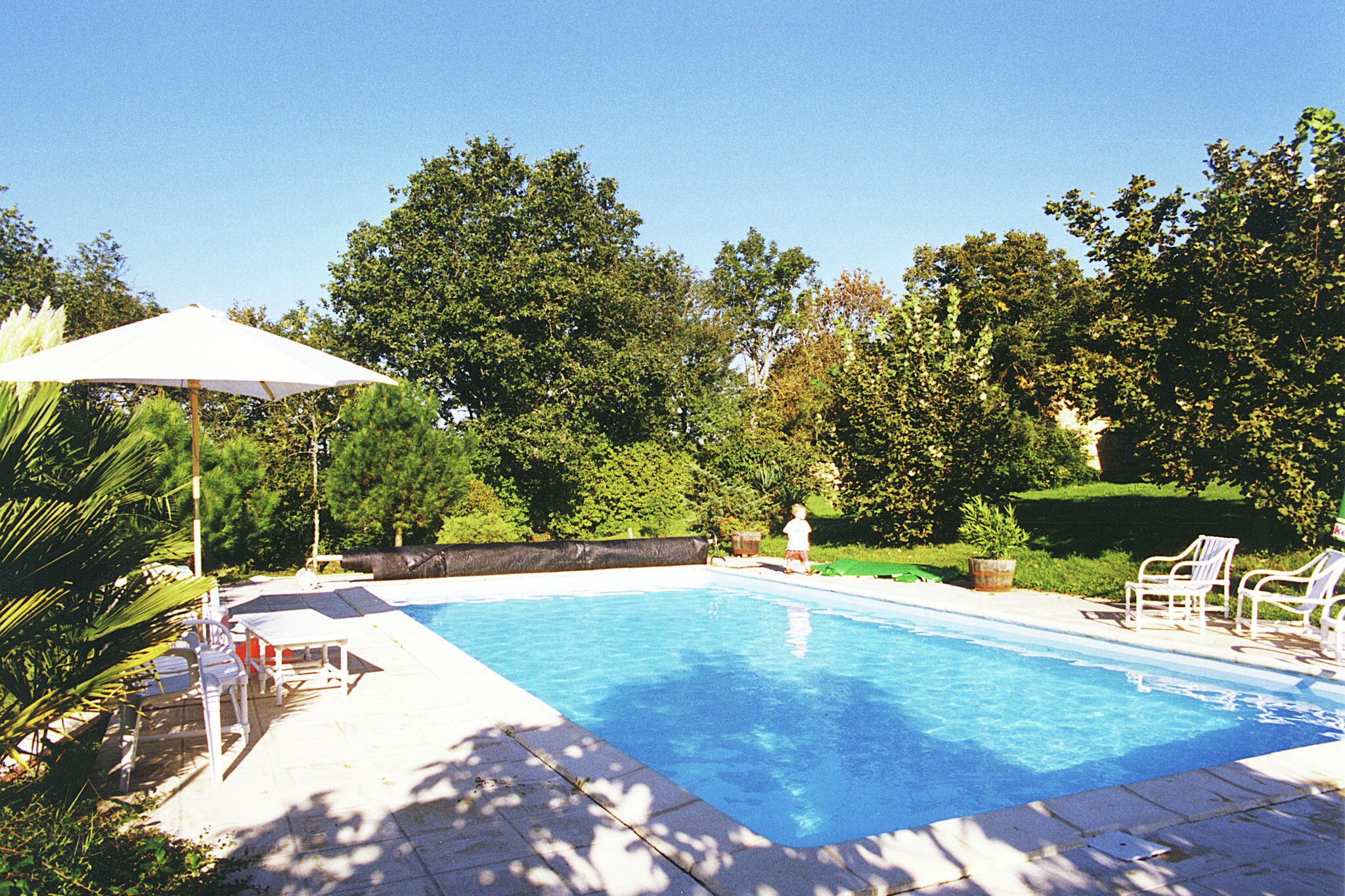 Holiday home with AC and private pool in forested surroundings.