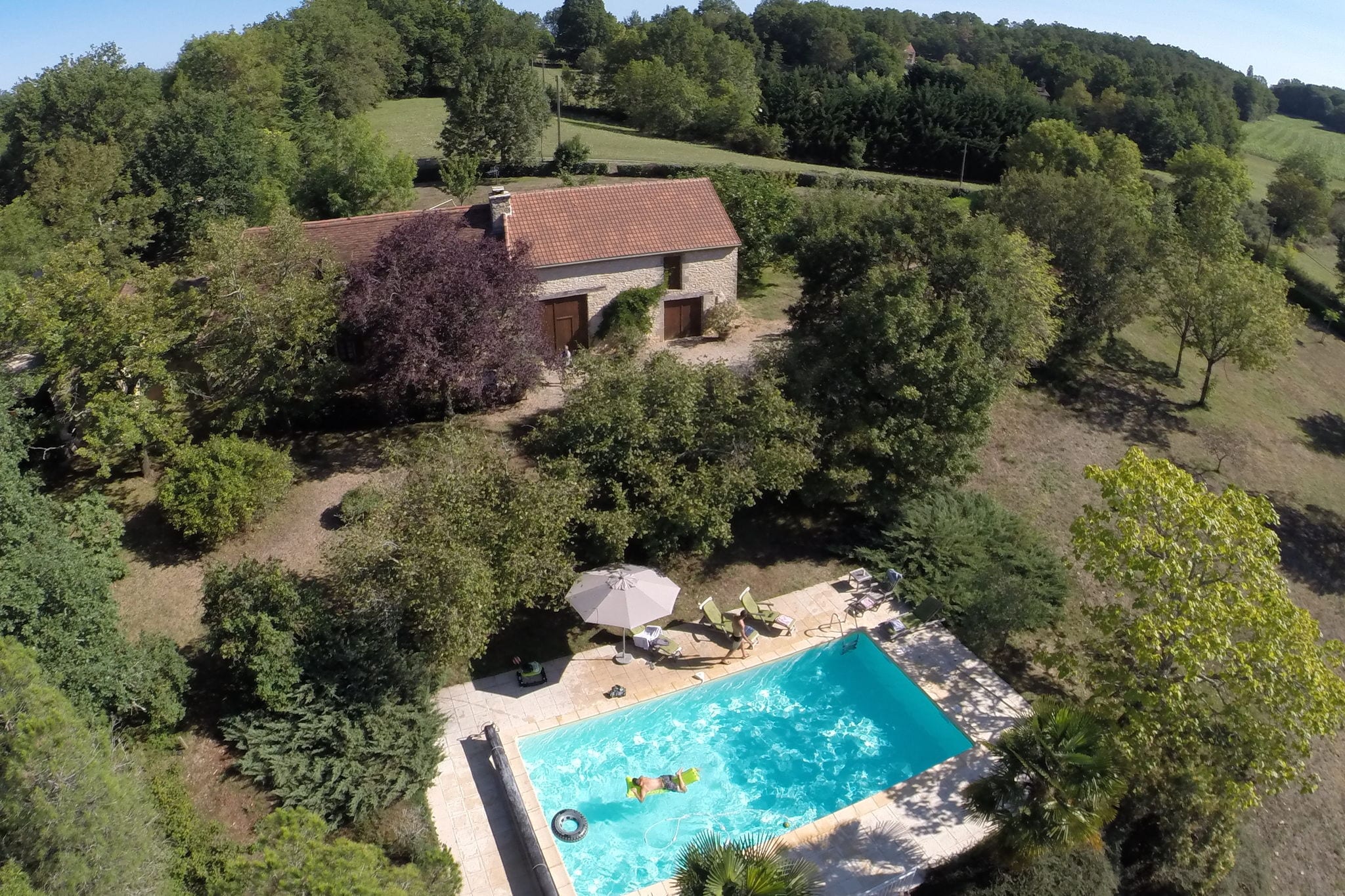 Holiday home with AC and private pool in forested surroundings.