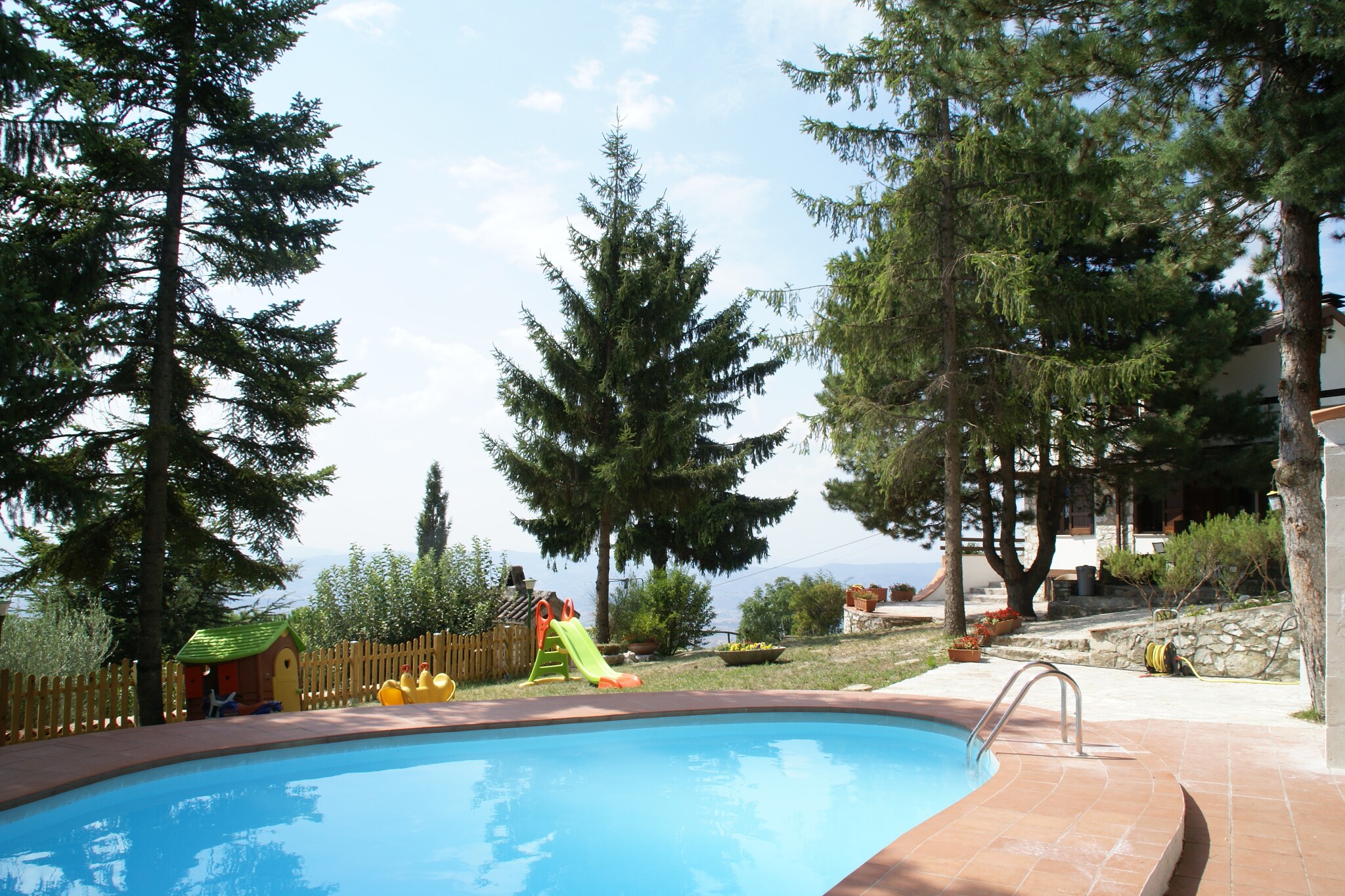 Discover a special panoramic location. This holiday home lies at an altitude of 810 metres, allowing you to enjoy a formidable view of the beauty of Umbria's nature and culture. This house is the perfect home base for taking beautiful hikes through the forested area around Monte Subasio. Take a refreshing dive into your own private swimming pool. With the provided barbecue and pizza oven you have everything you need for a culinary evening on the terrace.

Don't limit yourself to the house and its surroundings during your stay though. By car you can take a trip down the panoramic route through the area. Via the medieval village Collepino you drive over Monte Subasio to the hermitage \"Eremo delle Carceri di Assisi\". 

From here you can drive on to Assisi (18 km), the town of Saint Francis, with its basilica of the same name that consists of a upper and lower church in Gothic style. Follow the road in the direction of Spello (7 km). This characteristic town lies on a hill, which you enter through a beautiful Roman gate. From Spello you can drive through the hills to come home to your holiday home.

