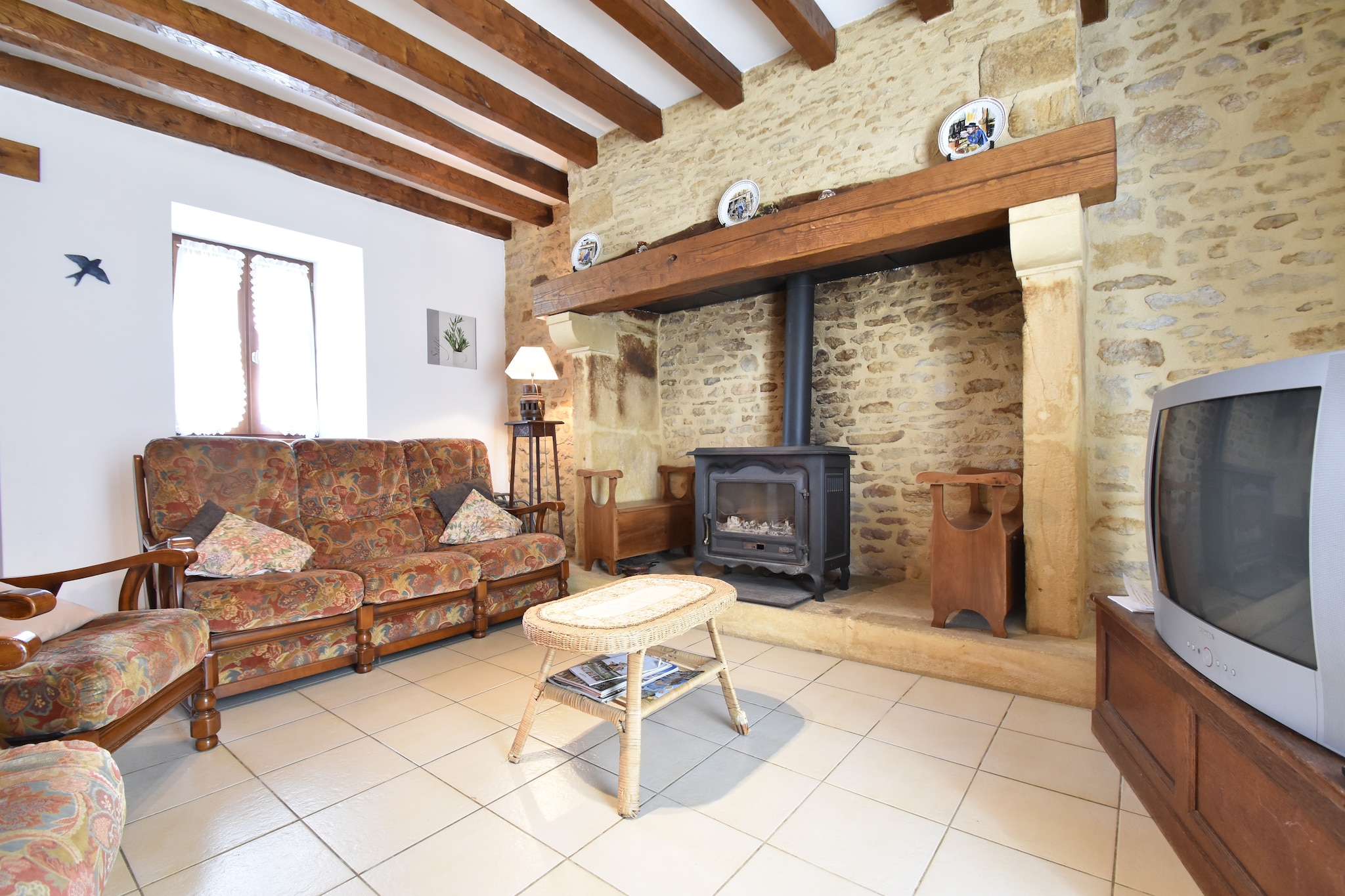 On the 1st floor: (Living room(TV, stove(wood), seating area, DVD player, CD player), Kitchen(toaster, coffee machine, oven, microwave, dishwasher, fridge, freezer, washing machine), bedroom(double bed(160 x 200 cm)), bedroom(2x single bed), bathroom(shower, toilet), toilet, Landing(single bed))\n\nheating(electric), terrace, garden furniture, BBQ, sand pit, play equipment, children\'s bed, high chair