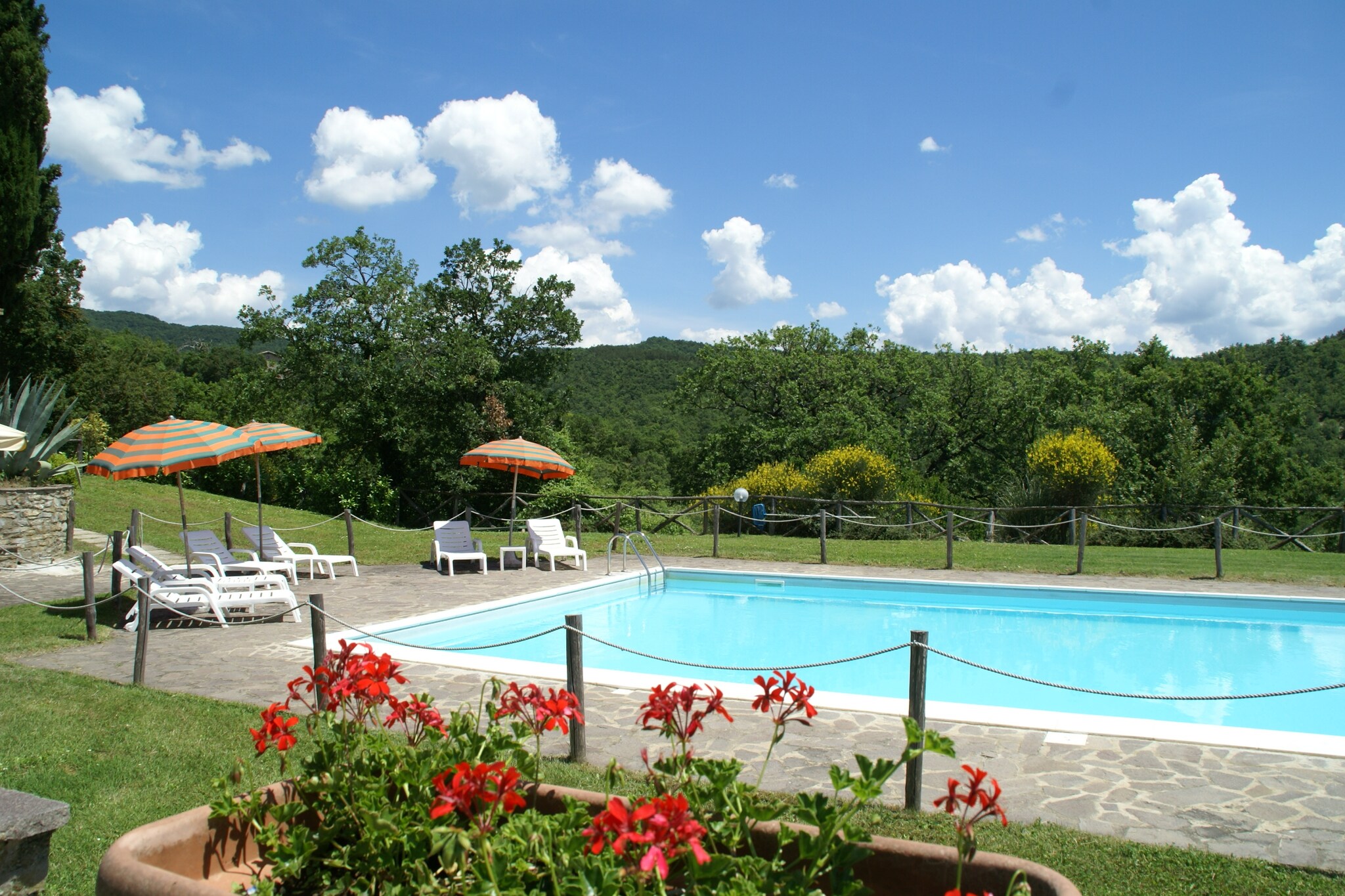 Ground floor: (Large kitchen(single sofa bed, TV), bedroom(double bed), bathroom(shower, toilet), heating)\n\nmezzanine: (bedroom(double bed))\n\nrecreation room(shared with other guests)(TV, table football), washing machine(shared with other guests), garden doors, terrace(private), garden(shared with other guests, fenced), garden furniture, BBQ(shared with other guests), swimming pool(shared with other guests, 15 x  7 m., opened from Jun upto and including Sep), table tennis table, bicycles available