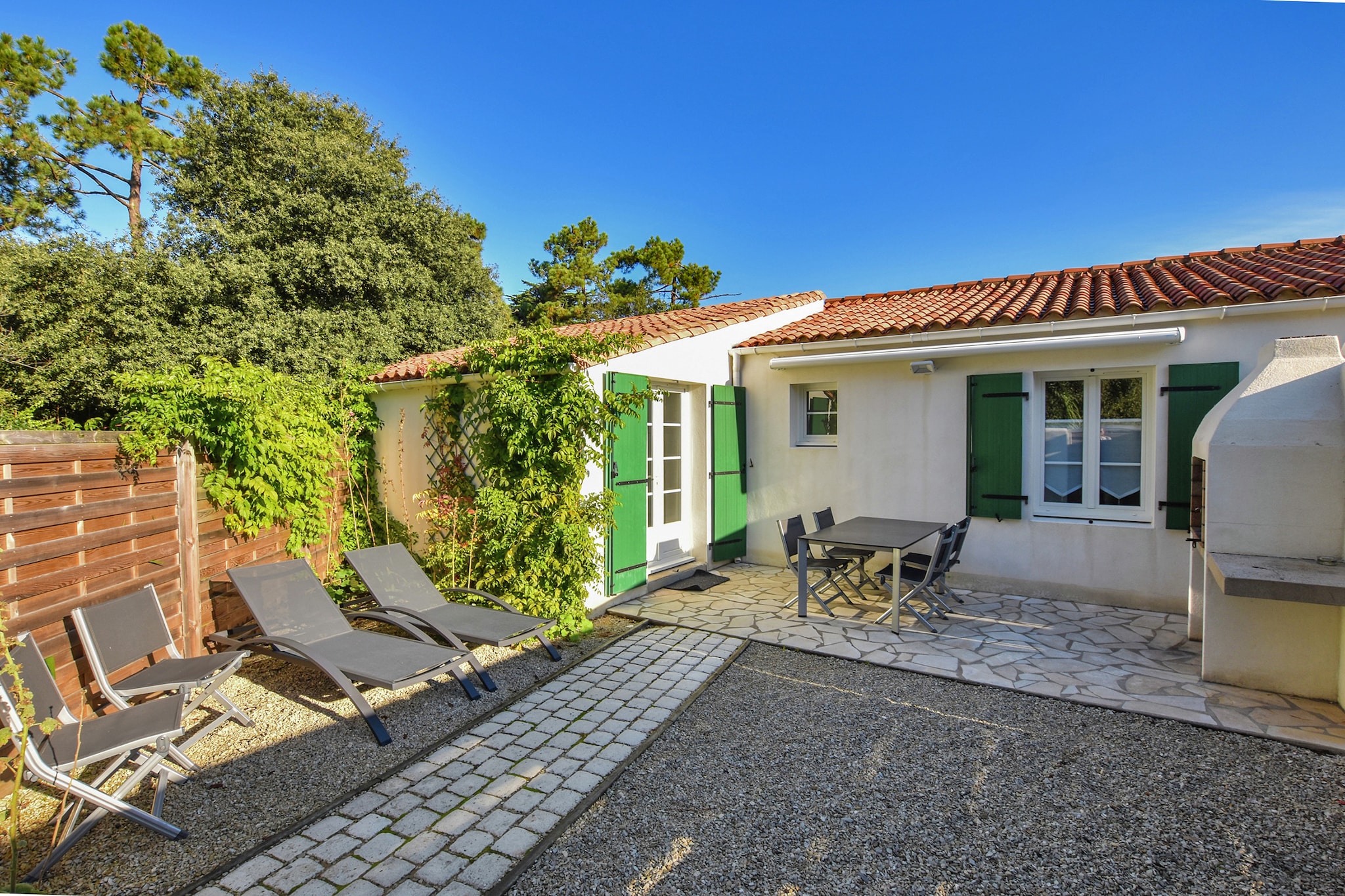 Close to sea as well as local facilities, the strategic location of this gorgeous 2-bedroom holiday home in Sainte-Marie-de-Ré makes it an excellent choice for travellers. Ideal for a family or small group of 5, this home features a fenced garden and private terrace for a relaxed vacation.
The restaurants, horse riding and water sports, as well as supermarkets, are within 2 km for your convenience. The town centre lies at 4 km. You can enjoy beachside activities, 300 m away from the holiday home.
This home has breezy vibes with subtle furnishings and features a fully-equipped kitchen. There is a fenced garden, where you can enjoy the sun. Heating keeps the home warm. The living cum dining room has a seating area and TV. Being a child-friendly home, cot and high chair are available on request.