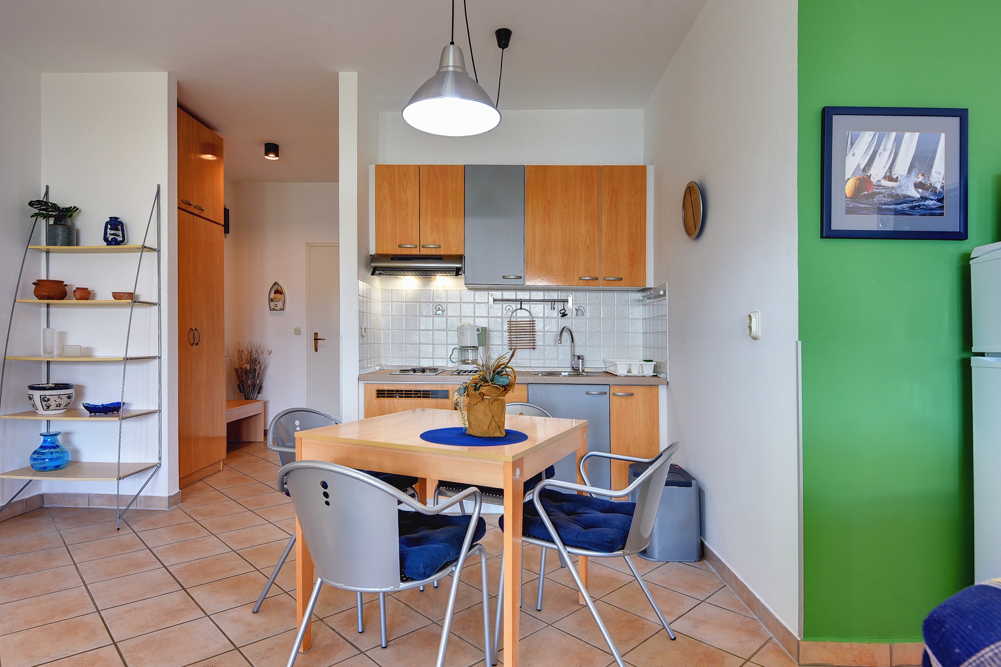 Ground floor: (open kitchen(stove, coffee machine), Living/bed room(single sofa bed, double bed, TV(satellite), cooker(2 ring stoves), coffee machine, microwave, fridge, freezer, air conditioning, terrace), bathroom(shower, washbasin, toilet))