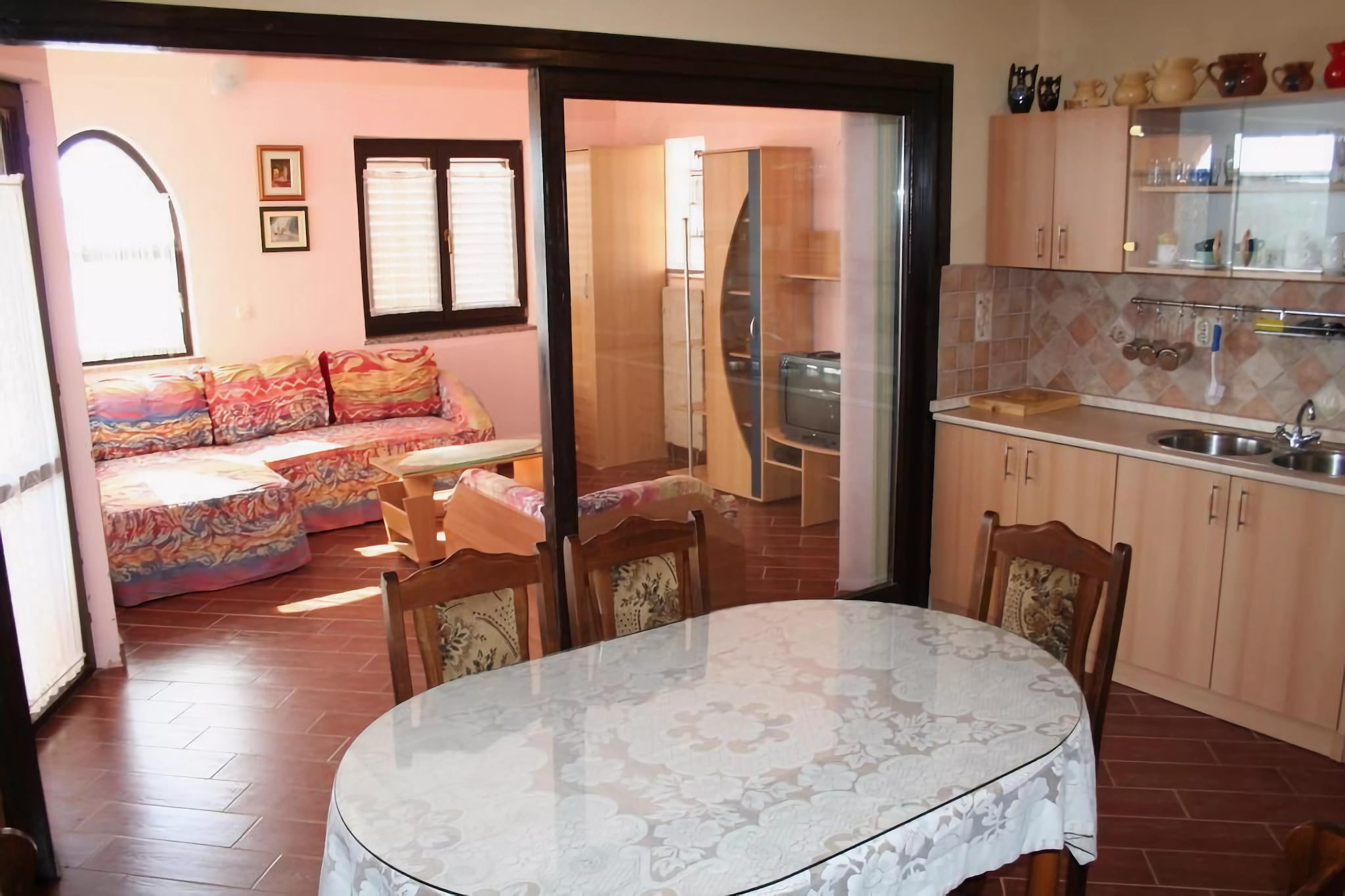 On the 2nd floor: (Living room(double sofa bed, TV(satellite), balcony, air conditioning), Large kitchen(oven, fridge, fridge-freezer), bedroom(double bed(160 x 200 cm)), bedroom(2x single bed(90 x 200 cm)), bedroom(2x single bed(90 x 200 cm)), bathroom(bath tub, toilet, bidet), bathroom(shower, toilet))\n\ngarden(shared with other guests ), BBQ, parking