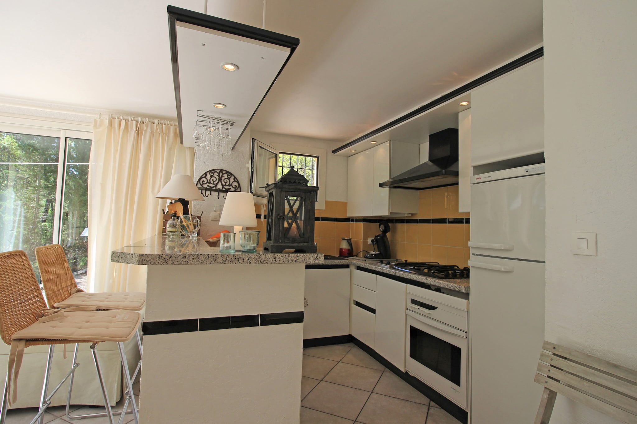 Ground floor: (open kitchen(bar, electric kettle, boiling water tap, cooker(gas), hood, coffee machine, oven, dishwasher, fridge-freezer, Juicer), Living/diningroom(single sofa bed, TV(flatscreen, satellite, international television channels), fireplace, CD player, stereo unit), 2x terrace(private, 12 m2, 40 m2))\n\nOn the 1st floor: (bedroom(double bed or 2 single beds), bedroom(double bed or 2 single beds, balcony), bathroom(bathtub with shower, toilet, washing machine, heating))\n\nterrace, garden(private, fenced, landscaped garden, illuminated, 900 m2), garden furniture, sun loungers, BBQ(gas), parking, deckchairs, parasol, swimming pool(shared with other guests, including separate children’s swimming pool (depth 50cm), opened from Jun upto and including 1/2 Sep), boules court, table tennis table, children\'s bed, high chair