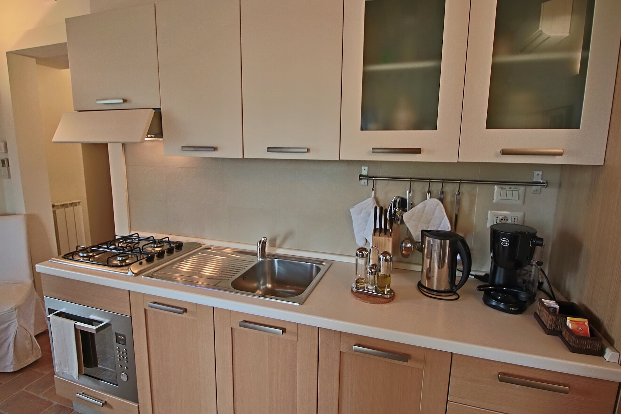 On the 1st floor: (Living room(single sofa bed, TV, DVD player), open kitchen(coffee machine(espresso), oven, microwave, dishwasher, fridge-freezer), bedroom(double bed), bedroom(bunk bed), bathroom(shower, toilet), air conditioning)\n\nterrace(roofed), garden(shared with other guests, fenced, > 1000 m2), BBQ(shared with other guests), swimming pool(shared with other guests, fenced, 13 x  6 m., opened from 1/2 May upto and including Sep)