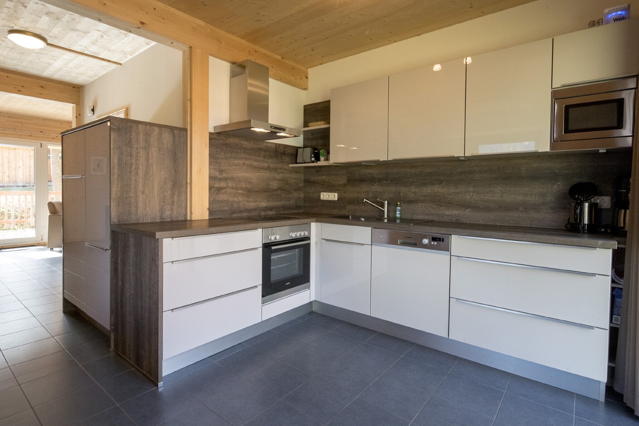 Ground floor: (Living room(TV(satellite), gas fireplace), open kitchen(electric kettle, toaster, cooker(ceramic), coffee machine(espresso, filter), oven, microwave, dishwasher, fridge-freezer, dishes and cutlery(Bowls, chopsticks, plates, cups, etc.)), bathroom(shower, washbasin, toilet), Internet access)\n\nOn the 1st floor: (bedroom(double bed), bedroom(2x single bed), bedroom(double bed), bedroom(single bed, bunk bed), bathroom(shower, infrared sauna, washbasin, toilet, hairdryer))\n\nBubble bath, washing machine, ski boot heaters, balcony, heating(electric, central), terrace, garden, parking